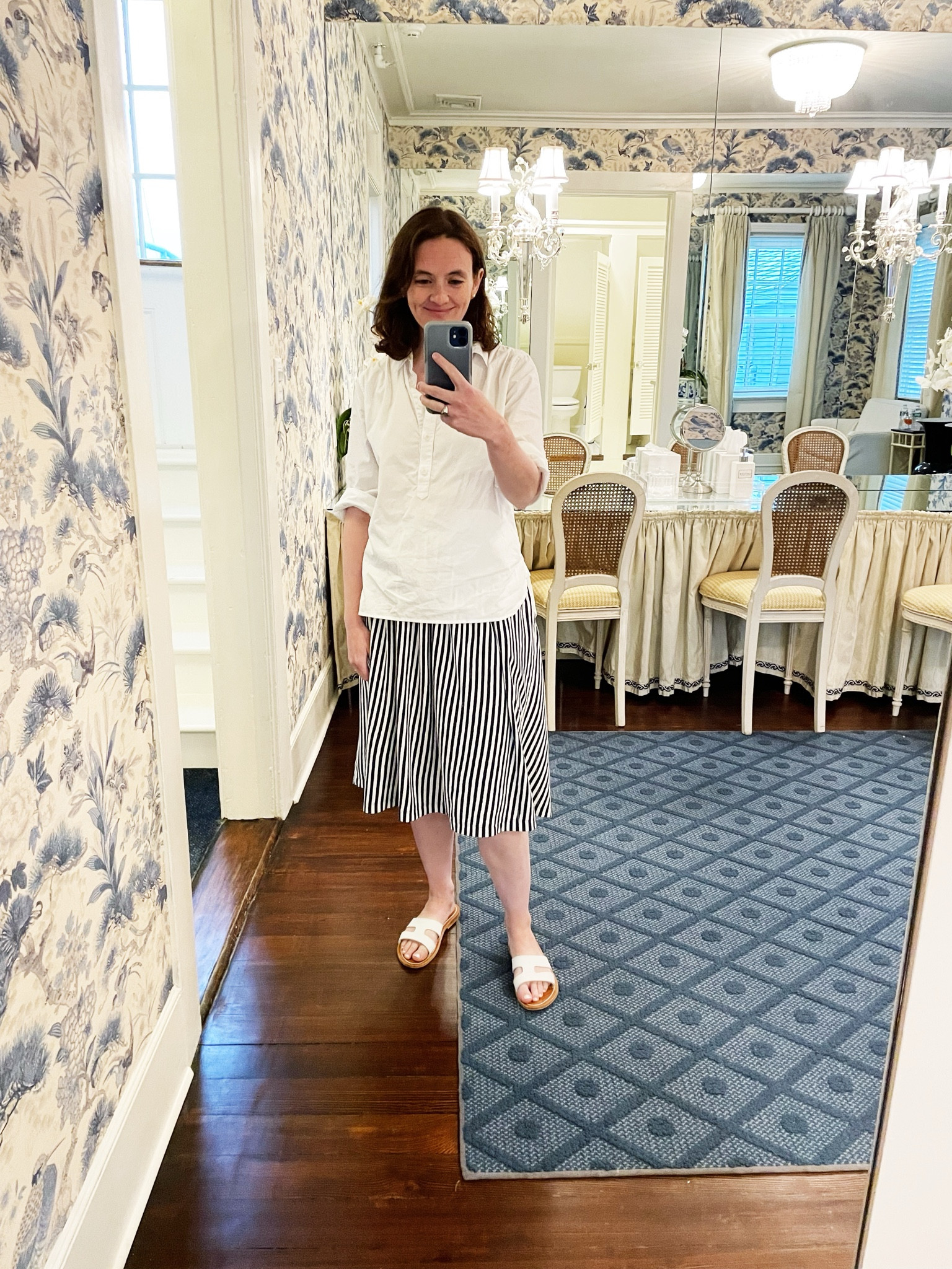 An untucked popover over a striped skirt is an easy way to get dressed without feeling too formal  

#LTKfindsunder100 #LTKSeasonal #LTKSpringSale