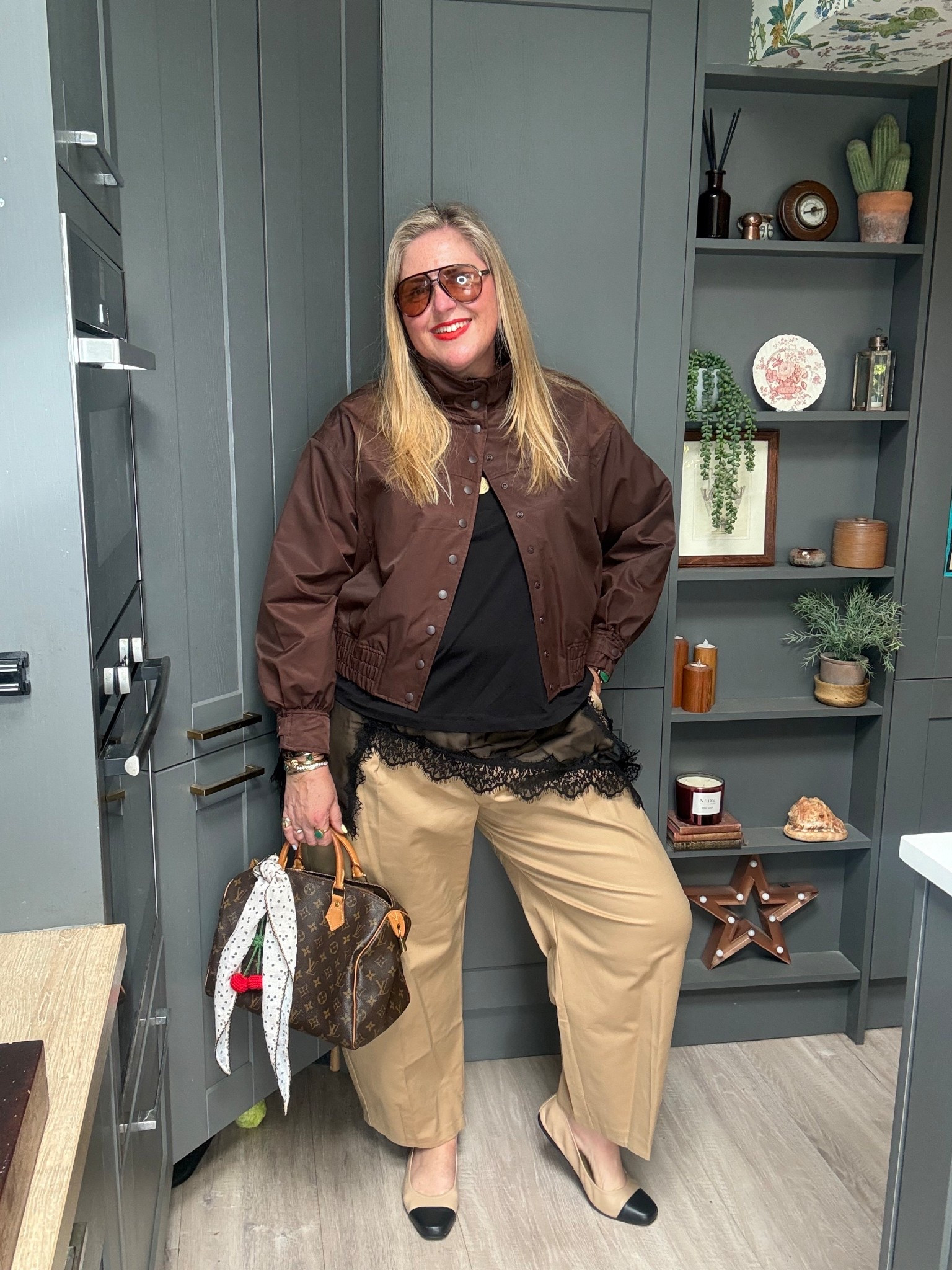 Barrel leg trousers, chocolate brown bomber jacket, black lace tshirt, brown tote bag, sunglasses, tan flats 

#LTKplussize #LTKspring #LTKstyletip
