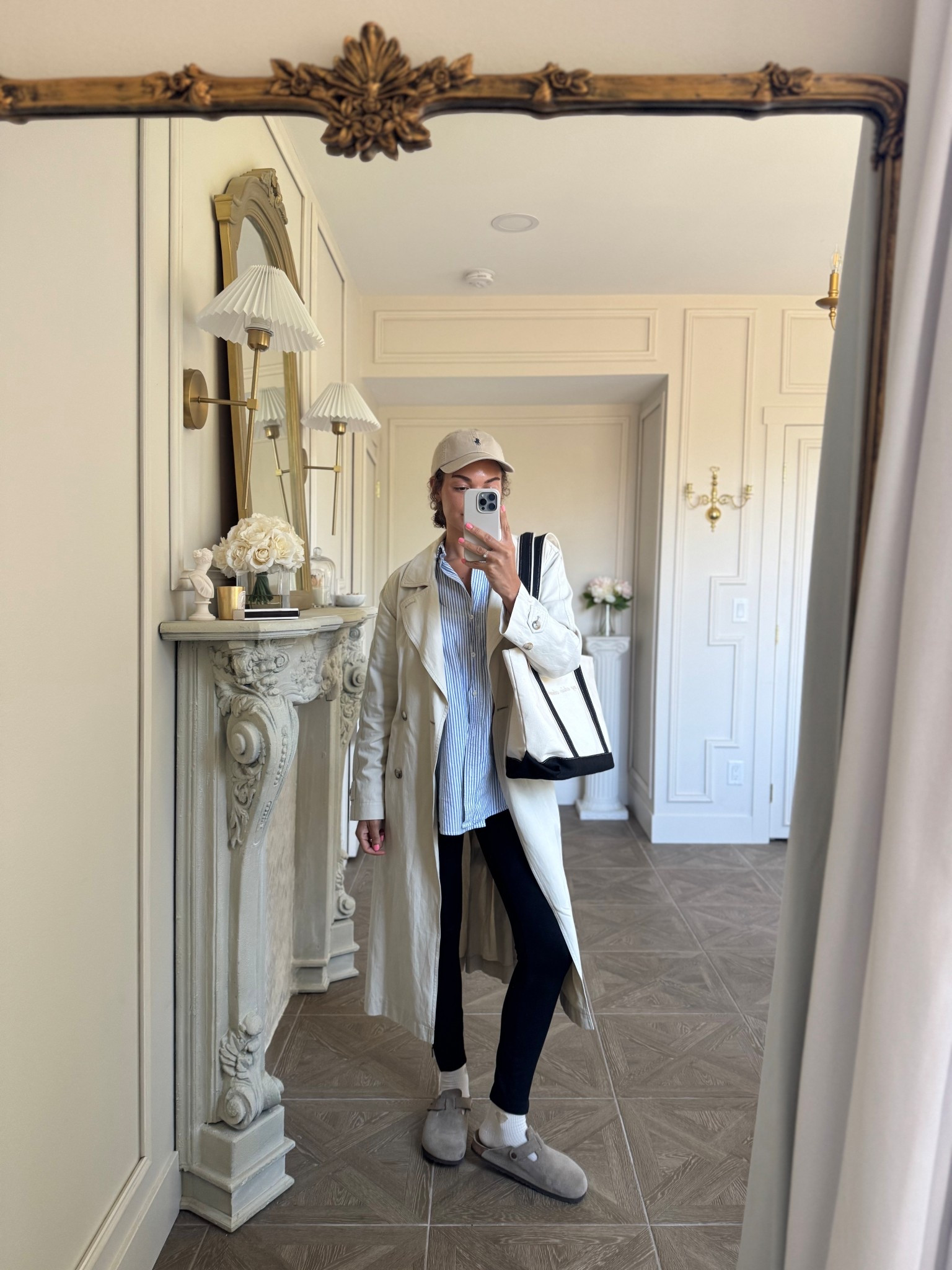 Casual spring outfit: leggings, oversized button up, clogs, trench coat, boat tote, baseball cap

#LTKdayinmylife #LTKootd