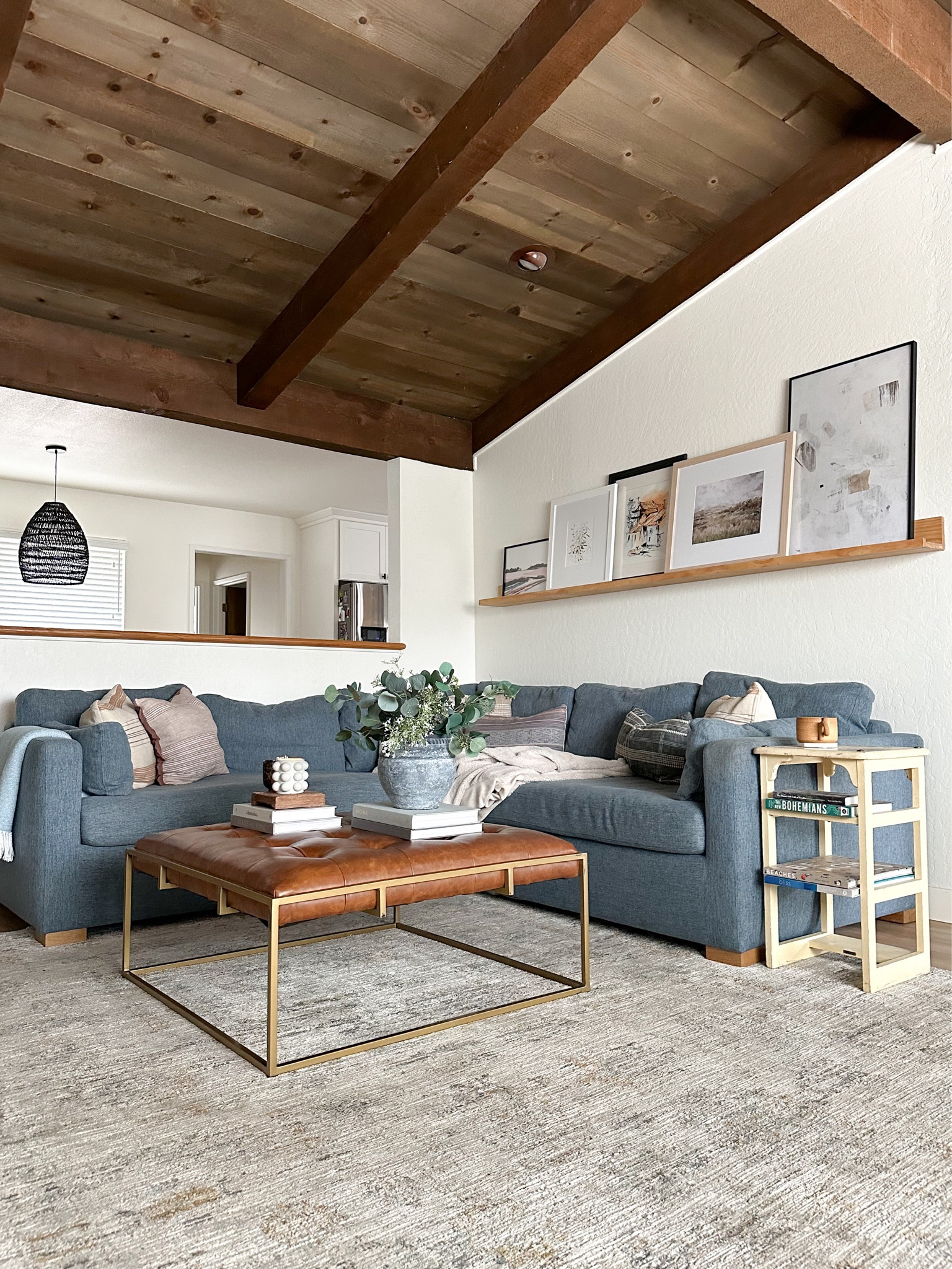 Our living room styled for spring. Leather ottoman coffee table, neutral living room. Sectional sofa, spring decor  

#LTKstyletip #LTKSeasonal #LTKhome