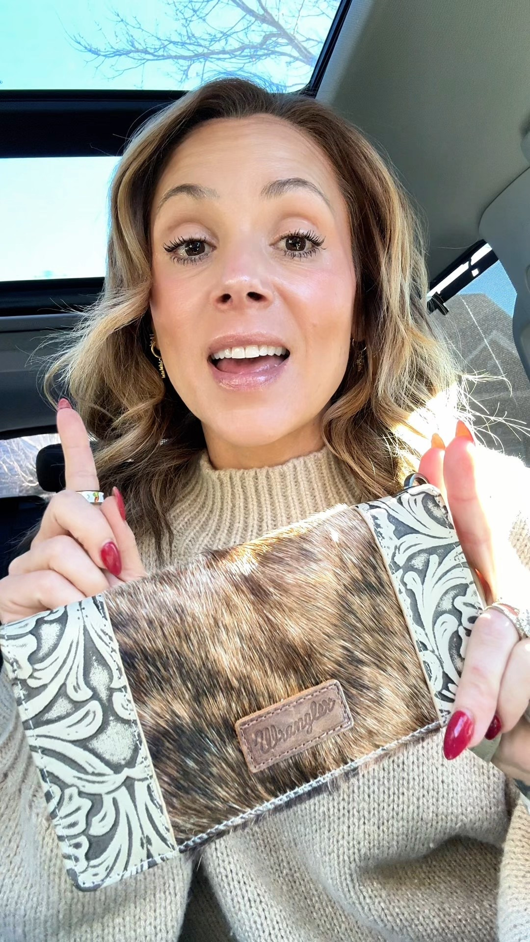 If you love easy grab-and-go accessories, this Wrangler wristlet wallet for women is one of those finds you’ll reach for every single day. This is a western wallet for women that combines function, style, and that classic Wrangler look — without needing a full purse. Perfect for errands, school pickup, travel days, concerts, or anytime you want to run out the door with just the essentials.

This Wrangler wristlet wallet features a floral tooled design and authentic cowhide detail, giving it that western-inspired, boutique-style look that works year-round. The boot stitch detailing adds just enough character to make it stand out while still being neutral enough to go with everything from jeans and boots to dresses.

One of my favorite features is the removable wrist strap, which makes this wallet incredibly versatile. Use it as a wristlet purse, carry it on its own, or toss it into a larger bag when needed. It’s lightweight, comfortable to carry, and designed for real life — not just looks.

Function-wise, this women’s wristlet wallet has a ton of pockets. Plenty of room for cards, cash, receipts, and everyday essentials without feeling bulky. If you’ve been searching for a western style wallet, cowgirl wallet, or Wrangler accessories for women, this checks all the boxes.

It comes in three different styles, ships free, and makes an amazing gift for women, gift for moms, gift for western lovers, or even a practical everyday wallet upgrade for yourself. These styles don’t stay in stock long, so if you’ve been looking for a cute, functional western wristlet, this is one to grab while it’s available.
 #wranglerwallet
#westernstyle
#westernfashion
#cowgirlstyle
#womenswallet
#wristletwallet
#westernaccessories
#cowhidewallet
#boutiqueaccessories
#everydayessentials