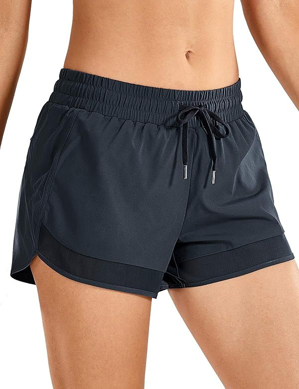 CRZ YOGA Women's Quick Dry Workout Running Shorts Loose Drawstring Athletic Gym Shorts with Zip P... | Amazon (US)