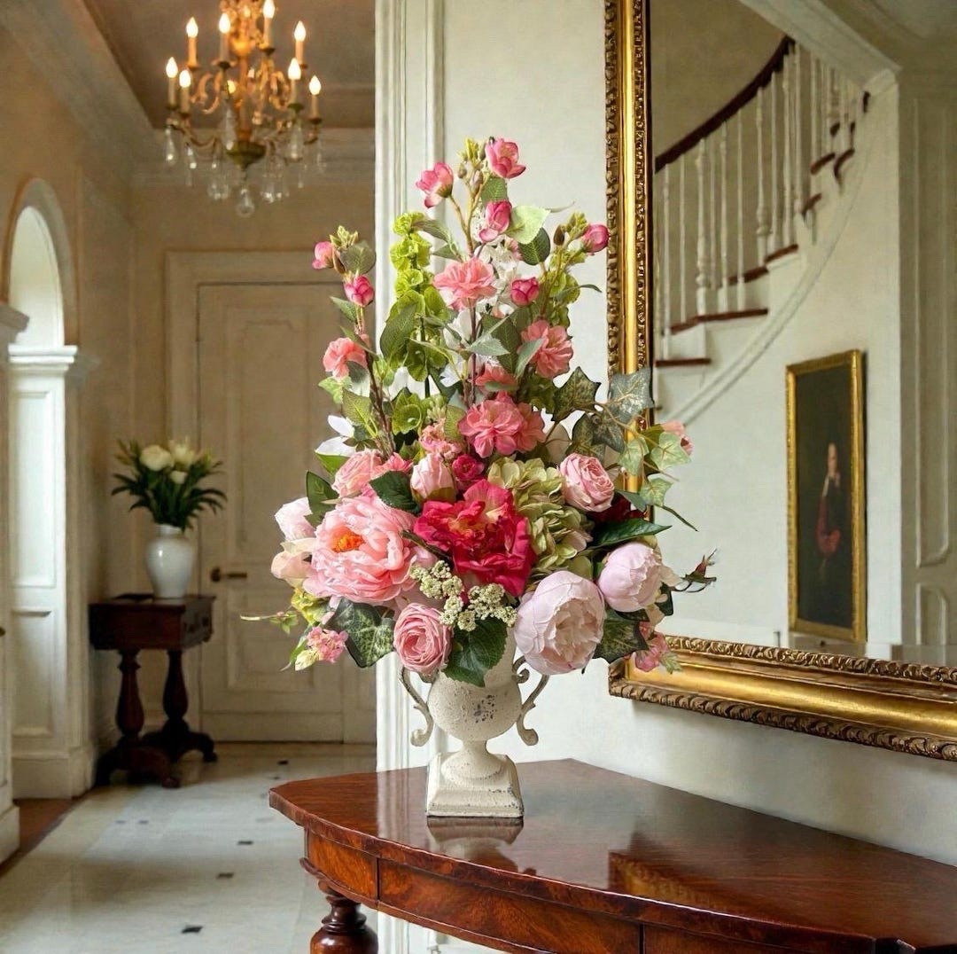 Elevate your home with this upscale spring floral arrangement designed to make a lasting impression. Set in a beautifully antiqued Old World urn, this lush display features roses, peonies, and hydrangeas arranged all the way around for a full, luxurious look from every angle. The soft eucalyptus accents add a natural, airy feel, making it perfect as a statement centerpiece for dining tables, entryways, or special occasions. #LTKhome #eleganthome #springdecor #floralarrangement #centerpieceinspo #homestyling #farmhouseelegance #etsyfinds

#LTKWedding #LTKHome #LTKSeasonal
