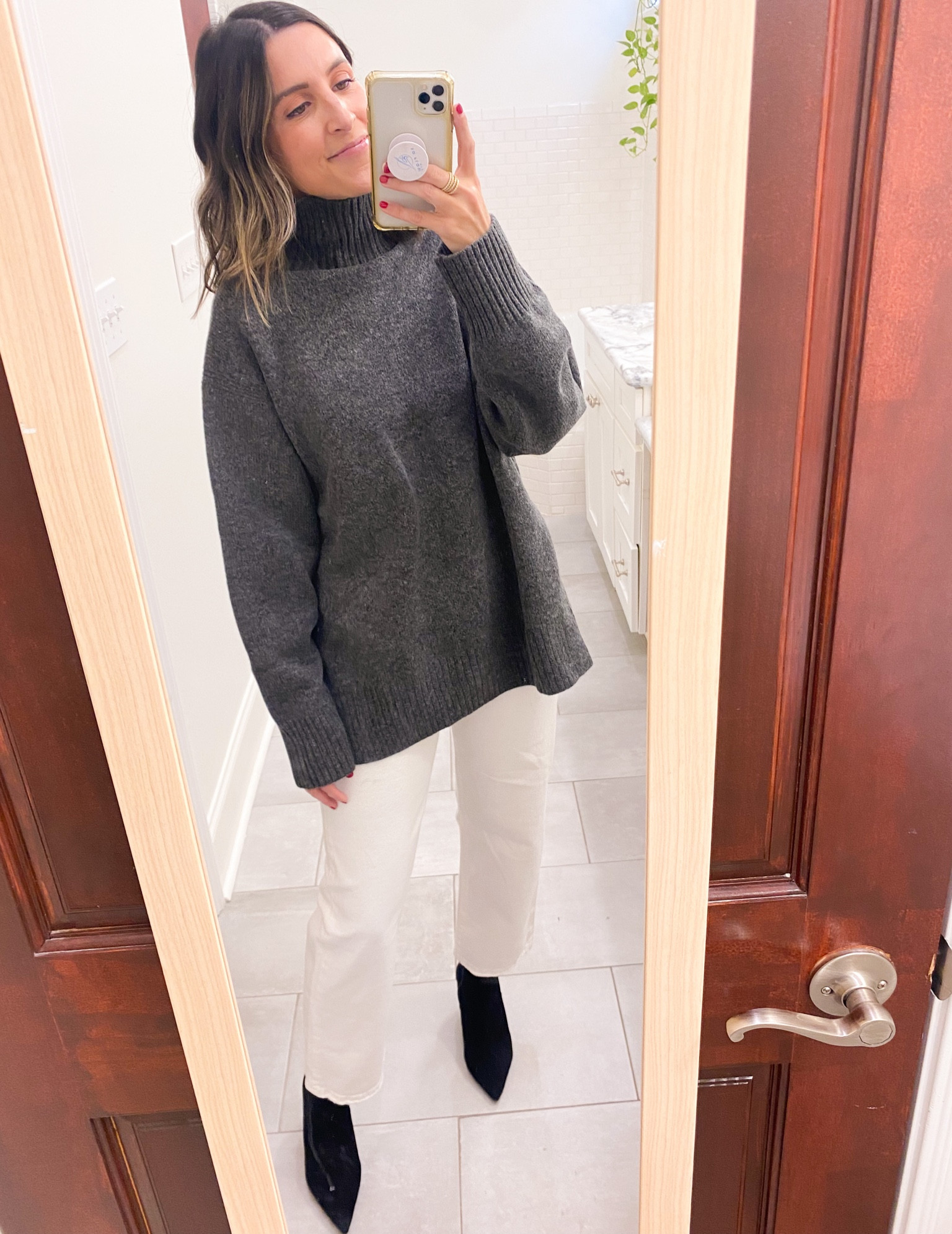 Sweater is oversized - wearing XS. Love the slits up side. Great quality! Denim runs TTS. Wearing size 26  