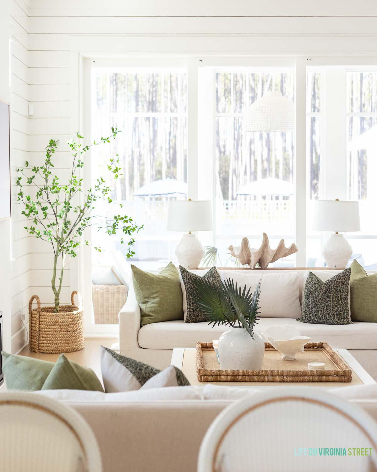 Coastal living room decor // modern coastal living room design // throw pillows // faux plant // faux stems // console table // coastal lamp 

 #LTKSeasonal #LTKHome