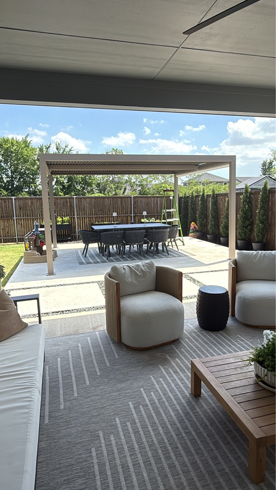 Added this louvered pergola to our patio!