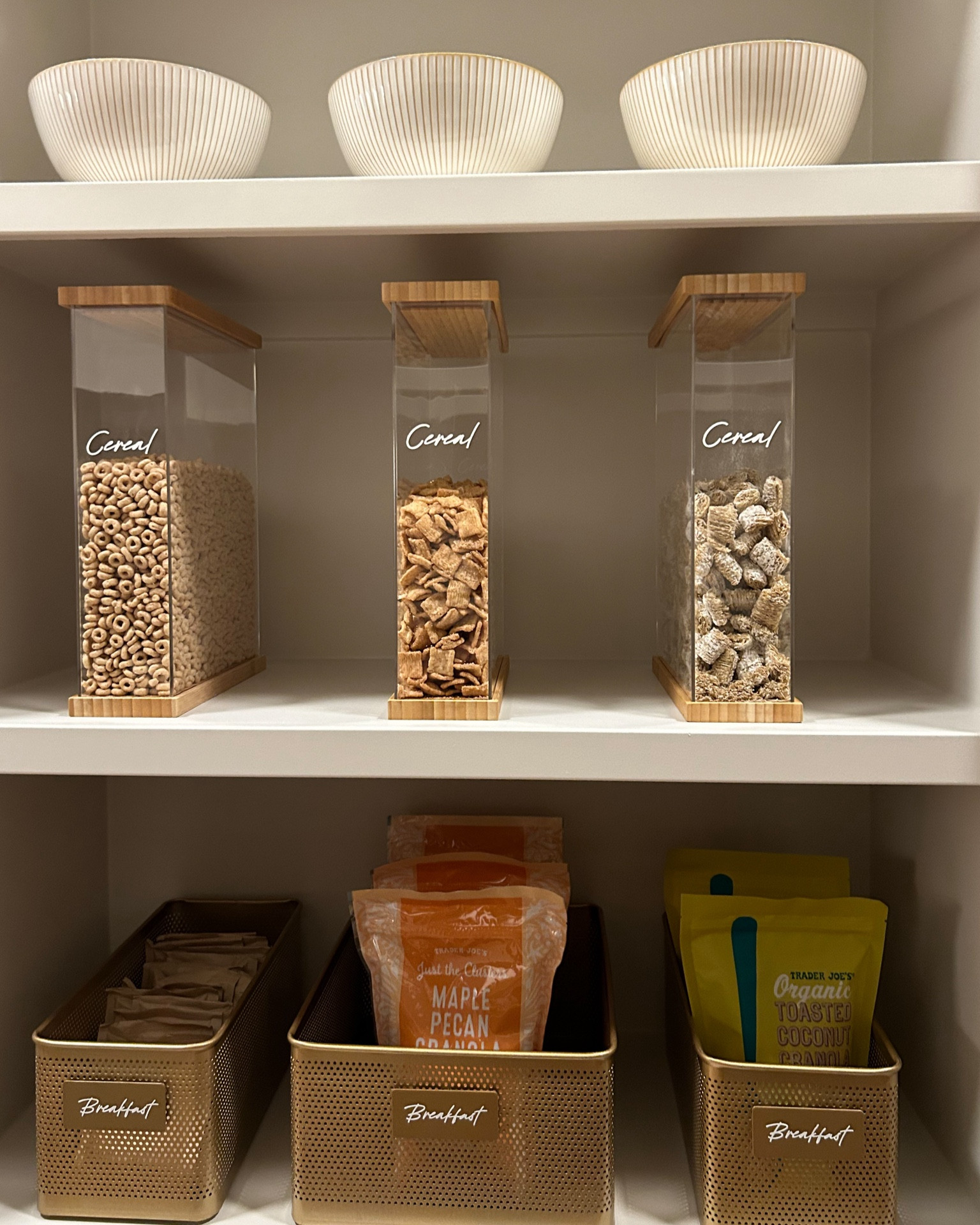 Obsessed with these sleek and stylish cereal containers from Crate and Barrel! Not only do they keep my cereal fresh and crunchy, but they also add a touch of elegance to my pantry shelves that is well worth the effort. 
Breakfast just got a whole lot more organized and Instagram-worthy! 🥣✨ #pantrygoals #organizationiskey #crateandbarrel #cereal #cerealcontainers #bamboolids 

#LTKstyletip #LTKhome