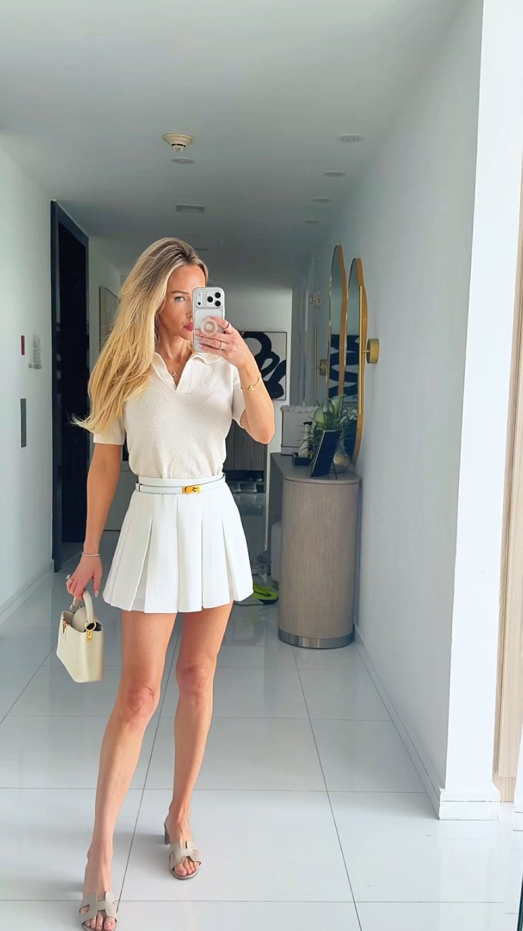 What I wore to shop in the design district and visit my SA at Hermes last week! Linking an Amazon version of this Hermes Kelly belt!
 Preppy outfit collared sweater mini skirt with hidden shorts. Belt accessories 

#LTKSaleAlert #LTKdayinmylife #LTKootd