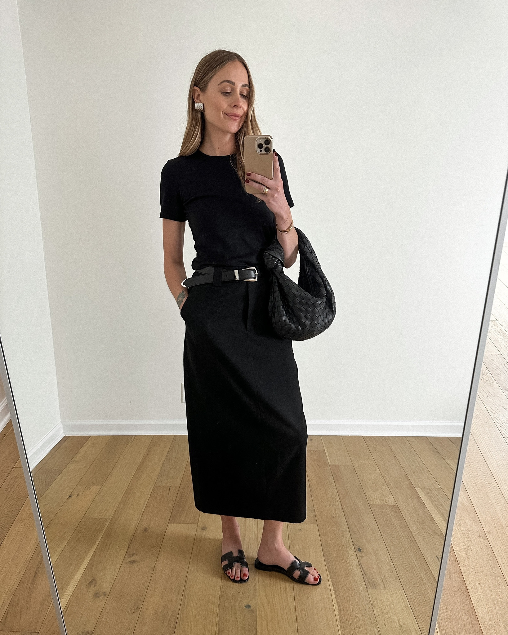 Fashion Jackson wearing black tee (small) black Colin maxi skirt (size down from your usual size), bottega handbag, Hermes sandals #fashionjackson #sandals #maxiskirt #falloutfit 