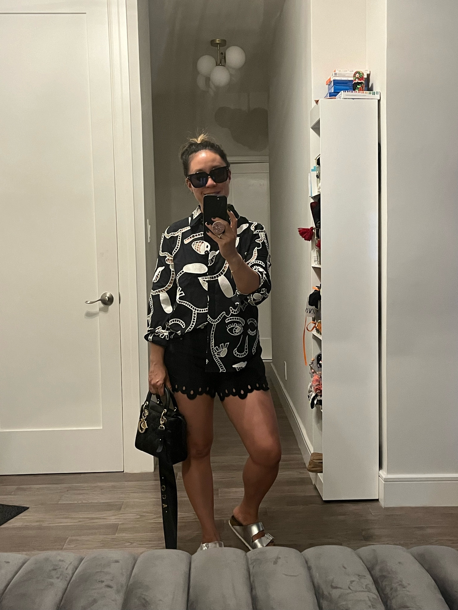 Eyelet top. Great transition top. Good unbuttoned with a swimsuit for the beach and then buttoned with shorts or a skirt for nighttime.

#LTKTravel #LTKItBag #LTKShoeCrush