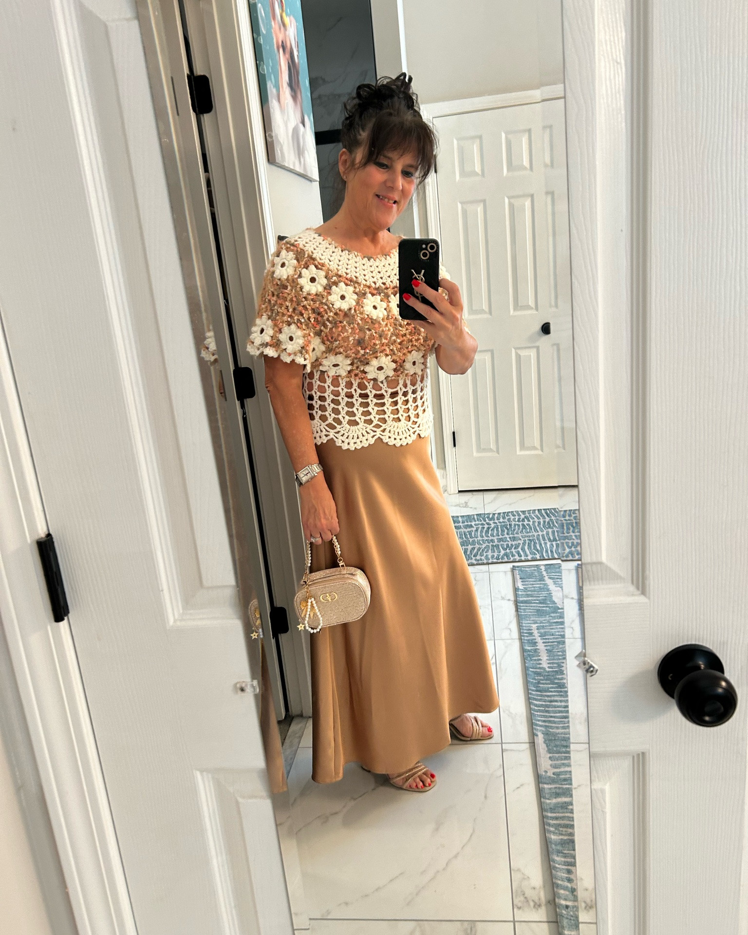 Date night ready!! 💃✨
This crochet top with the little flowers is just too cute 🥰 Paired with a satin coffee colored  skirt and gold bag — simple, but so classy!
Comfy sandals, a little gold, and I'm ready for a good evening out. Midlife date nights are the best! 💕
Always be confident! 💋
#over50fashion #styleover50 #datenightoutfit #agelessfashion #midlifestyle

#LTKgrwm #LTKWedding #LTKOver40