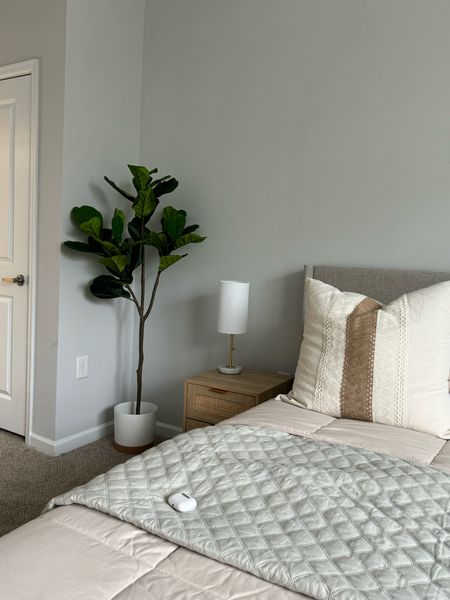 Bedroom decor on a budget. Pictured and linked: 

5ft fiddle leaf artificial tree 

Side tables: goes great with our hydraulic bed. 21.6” height  

Lamp has interchangeable intensity  

#LTKfindsunder100 #LTKsalealert #LTKhome