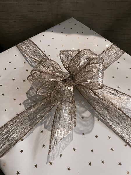 The prettiest white and gold star wrapping paper!

I added some gold wire ribbon and made the bow myself from it!

Another great last minute gift for hostesses or those who love to cook, is a sturdy mixing bowl and a glass measuring cup! Very affordable option for around $20 total!

#LTKhome #LTKGiftGuide #LTKunder50