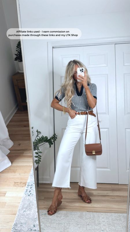 Casual summer outfit with white jeans and a striped knit
Europe vacation outfit idea