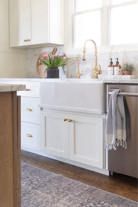 White and wood kitchen with brass faucet and fireclay sink, marble countertops, faux tulips, Amazon home finds  

#LTKhome #LTKSeasonal