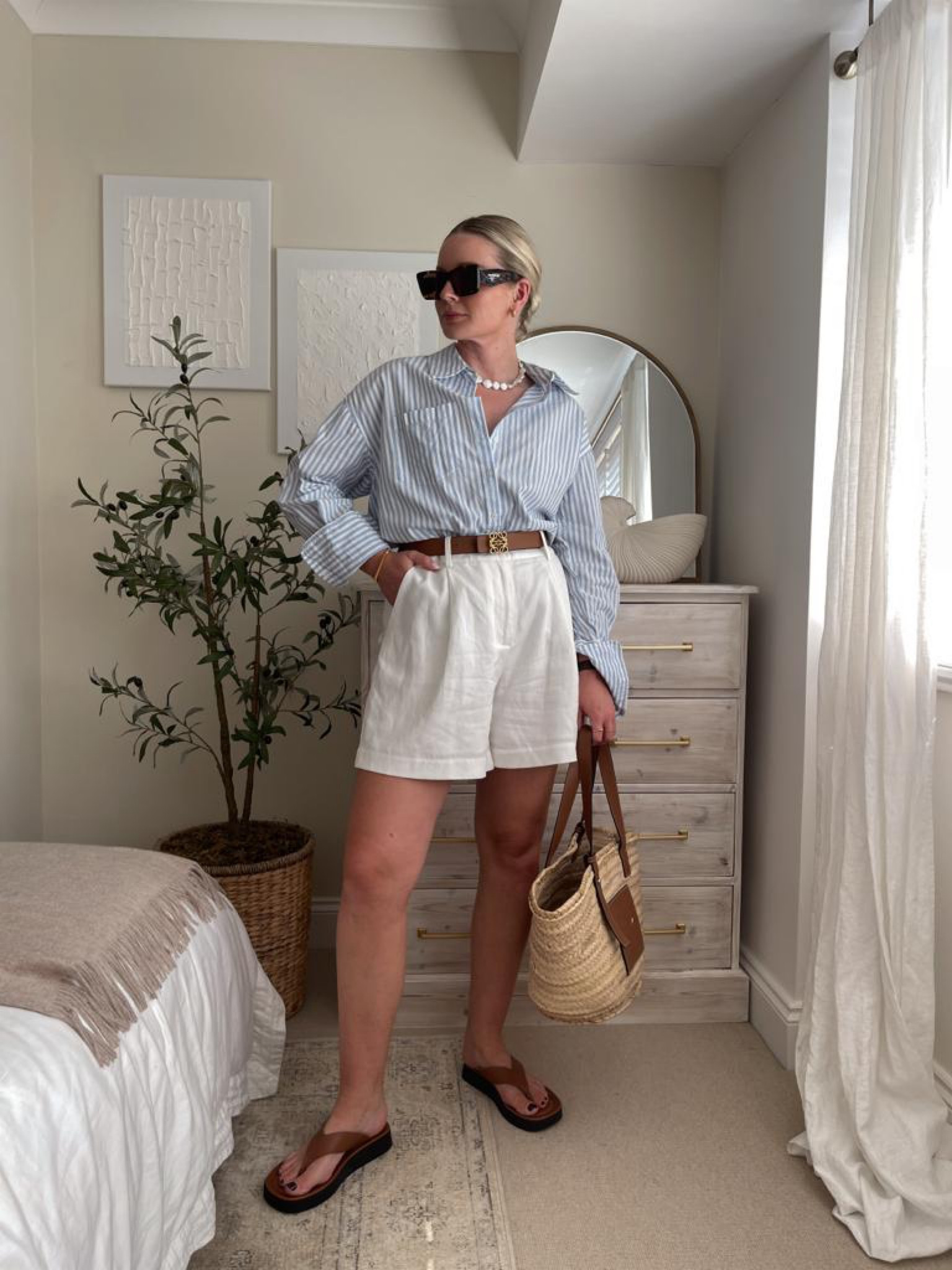 Five ways to wear white shorts for summer - blue and white striped shirt, tan platform flip flops, prada tortoiseshell sunglasses, pearl necklace, Loewe tan basket bag & reversible anagram belt  

#LTKeurope #LTKSeasonal #LTKstyletip