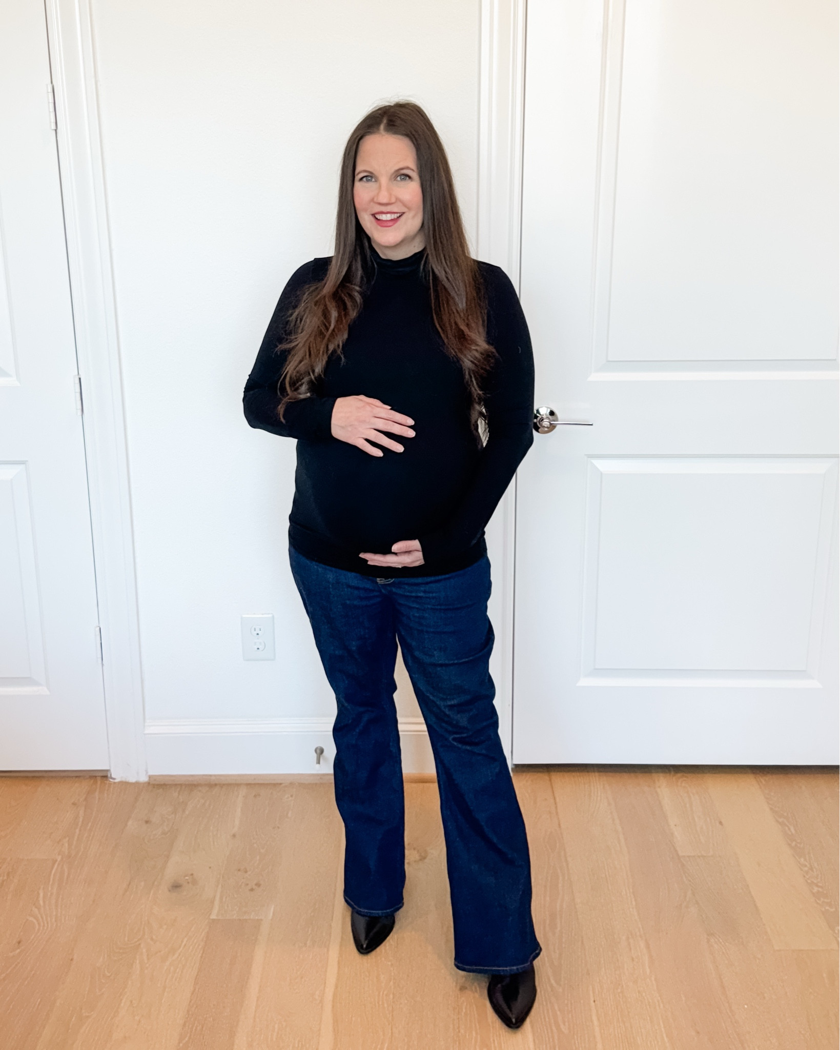This simple maternity outfit is one of my top polished everyday looks. A classic black long sleeve turtleneck paired with dark blue flared jeans creates such a flattering silhouette, and these are truly the best maternity jeans for comfort and support throughout pregnancy.

Finished with sleek black booties, this look is easy to dress up or down and works perfectly for everyday wear, casual plans, or even a relaxed workday. It’s a timeless maternity combination you can wear on repeat all season long.

Everything is linked below so you can recreate this chic, bump-friendly outfit

#LTKOver40 #LTKSeasonal #LTKBump