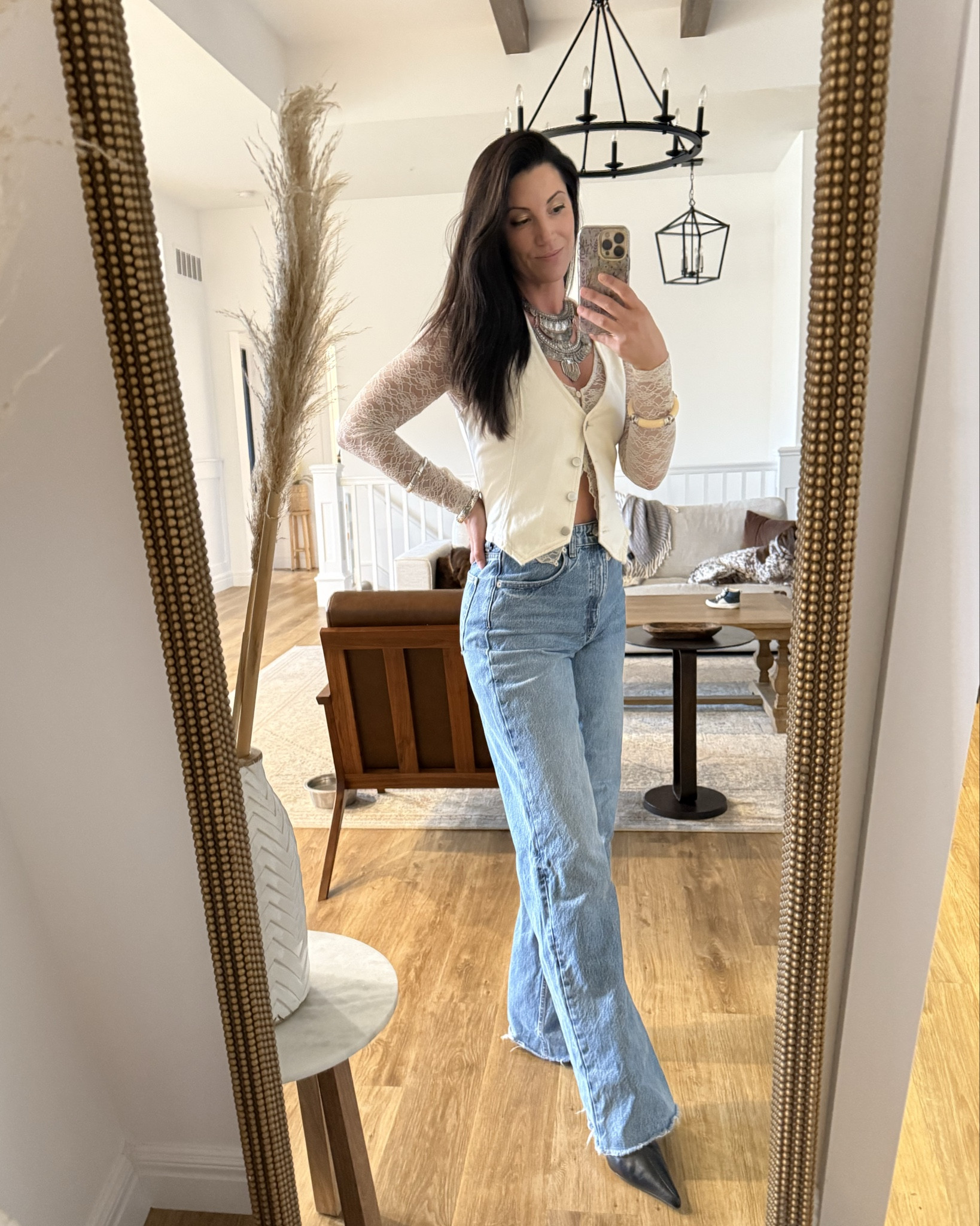 Concert outfit for all my 35+ mamas! I layered a lace top with a white denim vest and high waisted jeans! Paired it with an over the top silver bohemian necklace, bangles and black heeled boots! 🤘🏼🎸

#LTKFestival