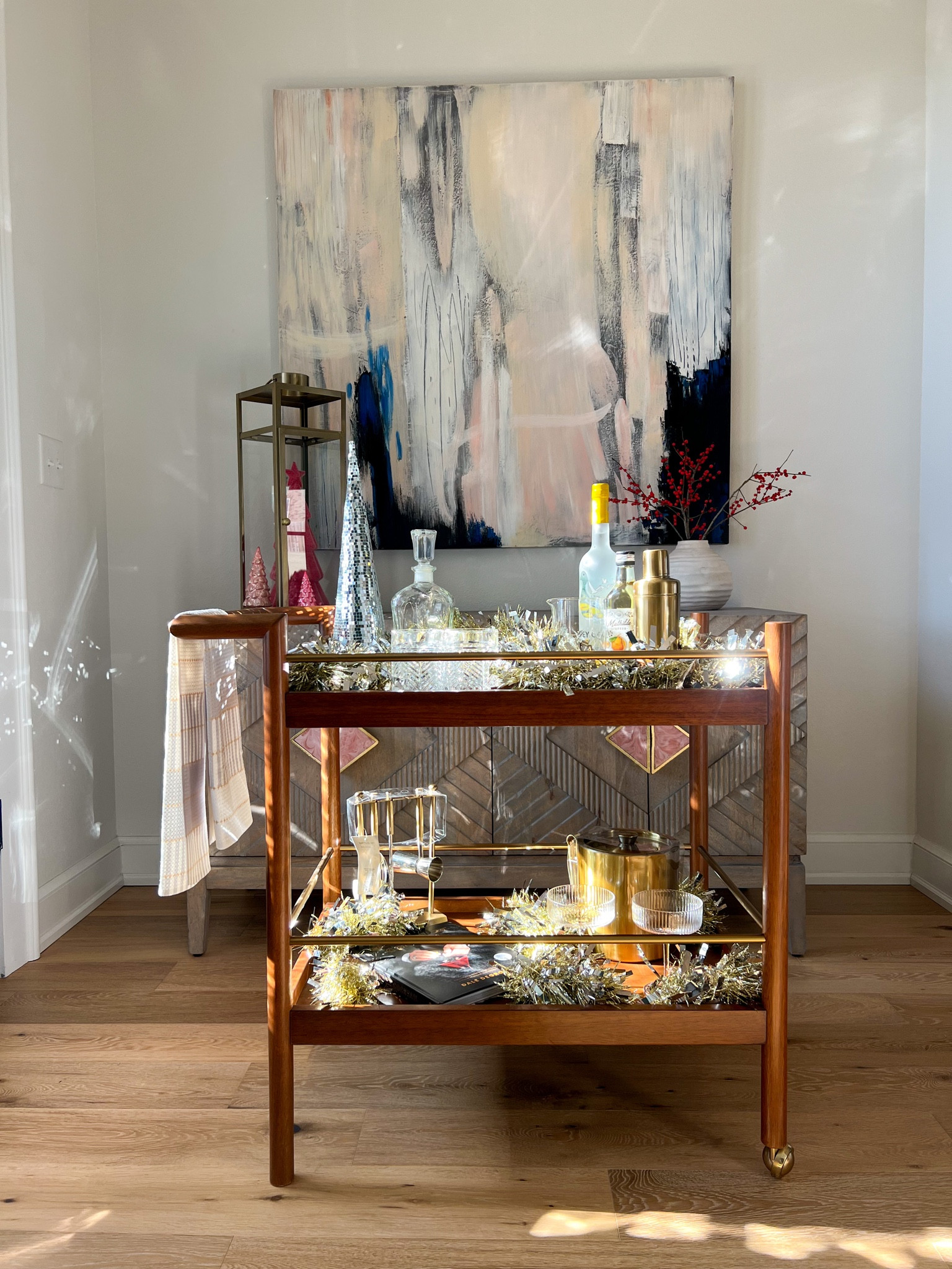 Making spirits extra bright! I love putting gifts together adding in personal touches like their favorite color, cocktail ingredients, and a book instead of a card. This barcart is on SALE right now for the season! 

#LTKGiftGuide #LTKsalealert #LTKhome