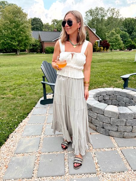 The backyard patio area is finally done and it’s supposed to rain all weekend! 🤣 Can’t wait to show you the before and after!! 🤩 I have been LOVING maxi skirts lately! This one is under $60 will be on major repeat! Paired with the cutest top on sale for $28! 💁🏼‍♀️ You can shop everything via the link in my bio > Shop my Reels/IG Posts ➡️

Sizing:
Skirt size small
Tank size medium (size up)

American Eagle, maxi skirts, summer outfits, spring outfits 

#LTKfindsunder100 #LTKstyletip #LTKsalealert