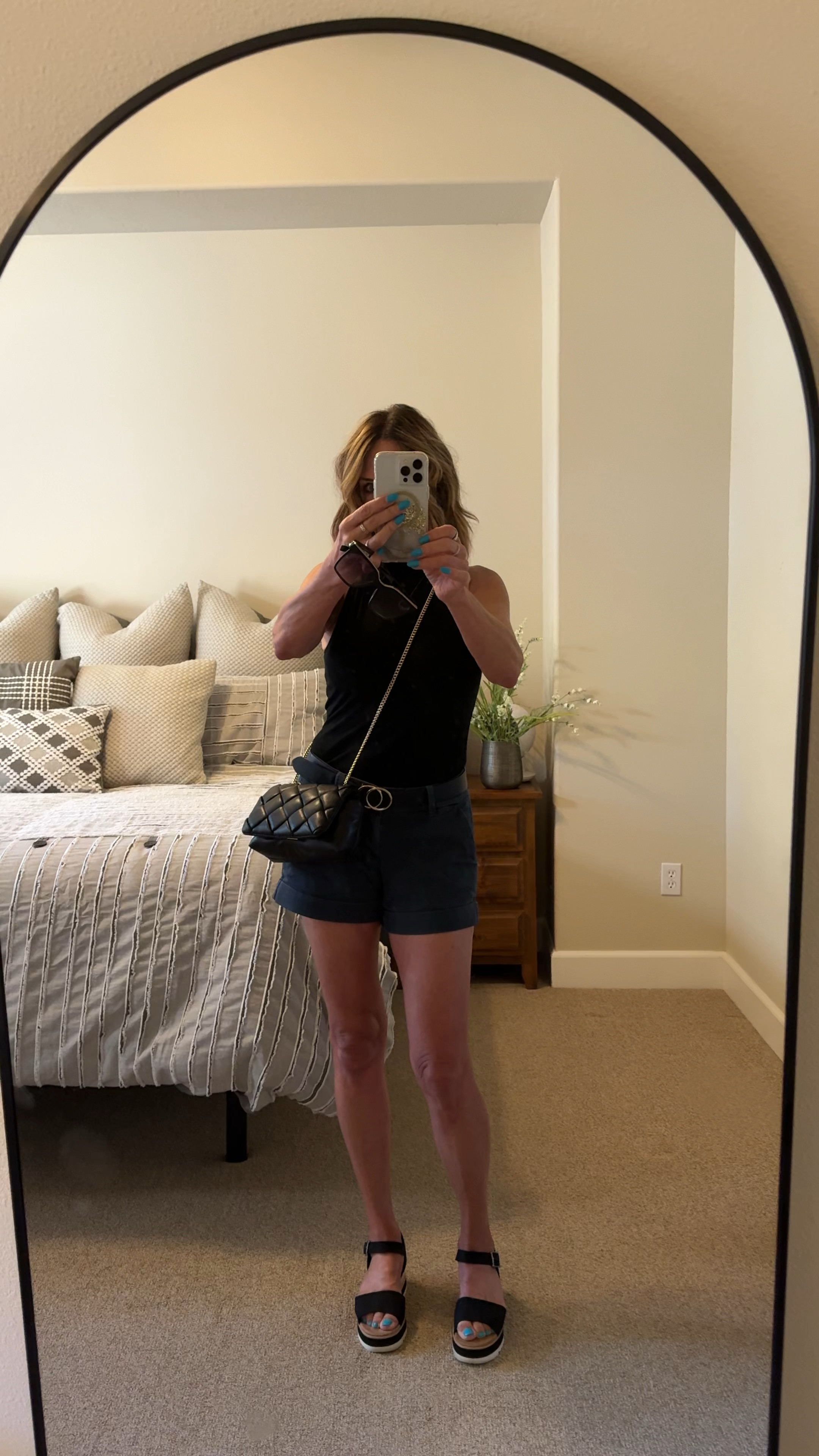 Outfit of the day. Super comfortable shoes, fashionable purse, and stylish sunglasses; all at an affordable price. Comforter set in background from Wayfair also tagged below #womensfashion #target #wayfair #zappos #walmart 