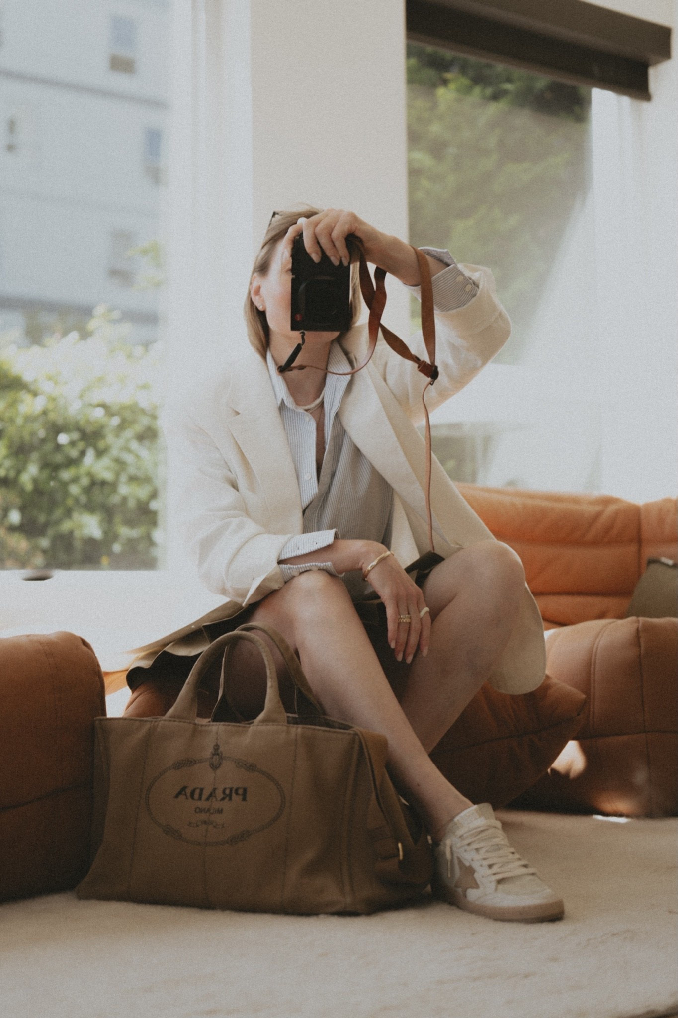 The mood is: June 1st, ready for that Summer weather but there’re things we need to finish first. 
White blazer + mini (micro, be fair) skirt + striped oxford shirt + oversized canvas tote + retro sneakers 
Blazer: Buck Mason 
Skirt: 7 for all mankind @Anthropologie 
Shirt: Golden Goose 🪿 
Sneakers: Golden Goose ball Star sneakers 
Bag: Prada Canapa (vintage)
Similar looking styles linked as always 😘

#LTKootd #LTKSeasonal #LTKWorkwear