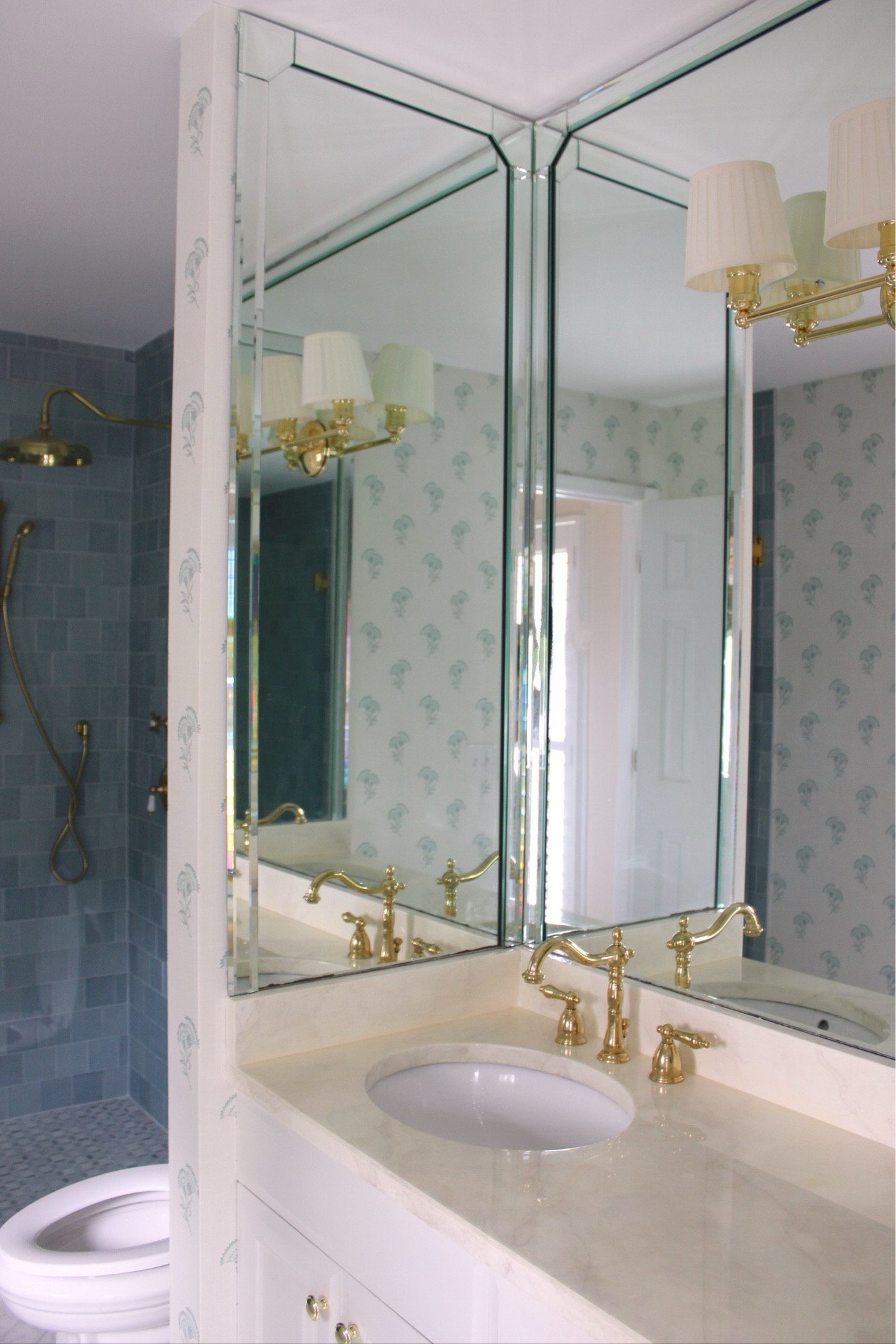 Our DIY master bathroom makeover is finally complete! I have linked all of the hardware, fixtures, and the wallpaper that I used to this post! All of the tile is from floor and decor, but I wasn’t able to link it! 