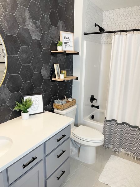 I decided to upgrade my kid’s builder grade bathroom with peel and stick tile. Best decision ever! It’s a great budget-friendly way to upgrade your space.

#diy #children #remodel #bathroomdeisgn #homedecor

#LTKfamily #LTKhome #LTKsalealert