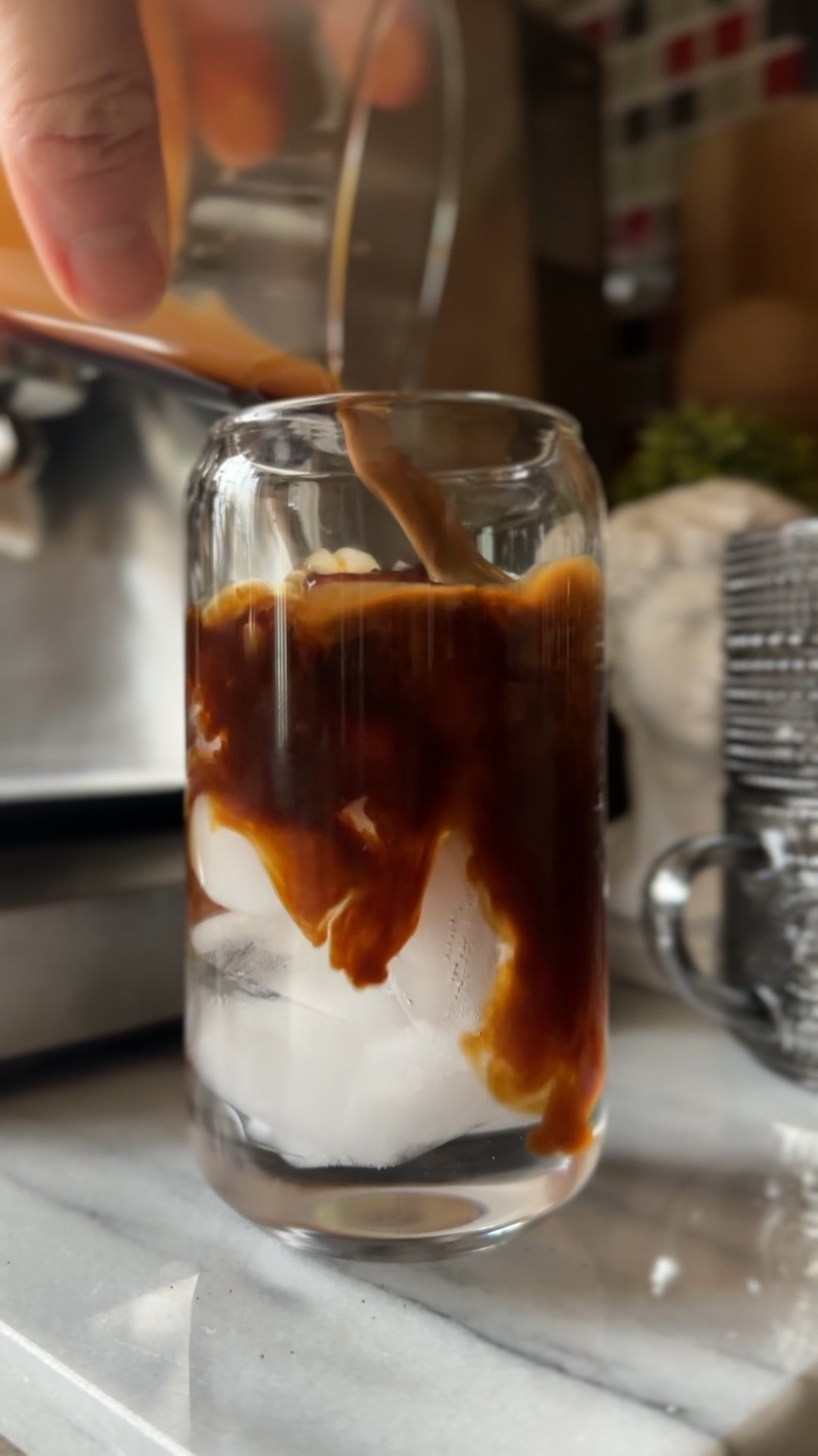 Simple Iced Americano at home with the Breville Barista Express espresso machine. 

Measure out 18G of beans and grind
Brew approximately 36G of espresso (1:2 ratio) 
Pour over iced water for a 2:1 ratio of water to espresso. 

Enjoy! 

Coffee lovers // iced coffee // coffee glasses // Amazon glassware // coffee accessories // coffee bar // coffee station 

#LTKGiftGuide #LTKhome #LTKVideo