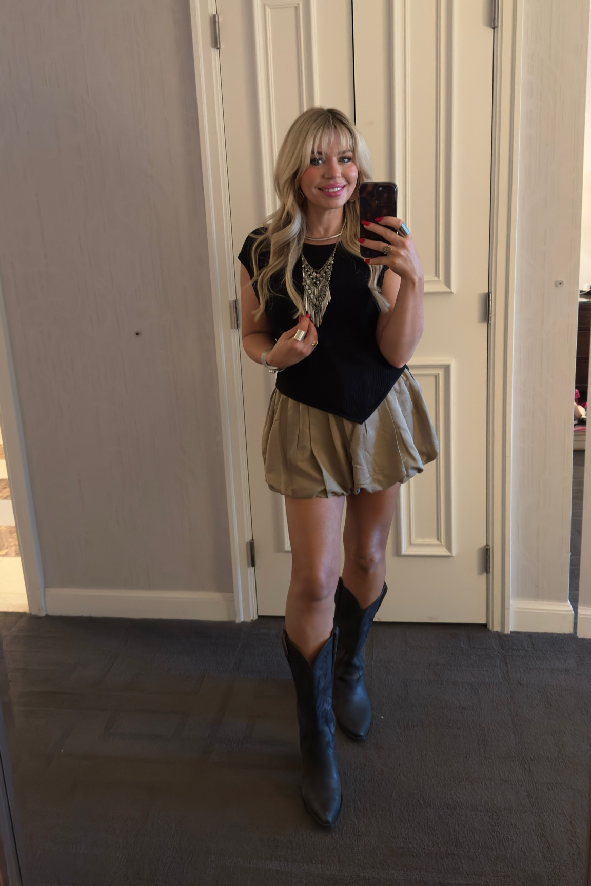 Zara black fishnet sweater tops size large (I wanted a baggy look) 
Tan ballon shorts size medium 
Black boots size 7 