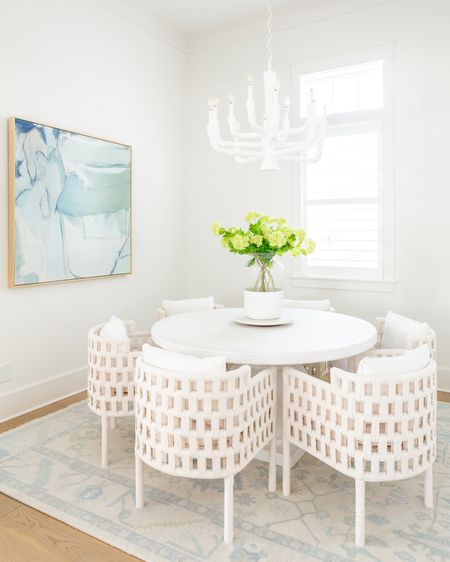 *Our dining chairs and dining table are an extra 20% off with code SALE* Absolutely loving these faux viburnum stems for spring! They look perfect in our coastal dining room paired with our blue abstract art, white concrete dining table, white rope dining chairs, color block vase and carved white wood chandelier! I have four sets here for this very large vase.
.
#ltkhome #ltkfindsunder50 #ltkfindsunder100 #ltkseasonal #ltksalealert #ltkover40 spring decorating ideas. Simple spring decor. Spring dining room

#LTKsalealert #LTKhome #LTKSeasonal