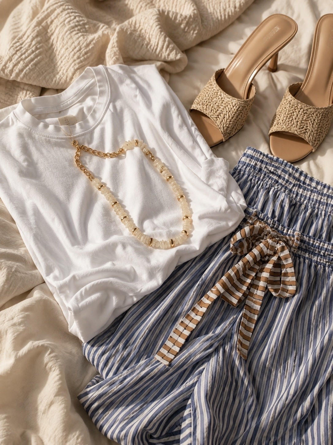 Amazon FP look for less that feels way more expensive than it is 🤍✨
These striped pants are the kind of piece that instantly gives effortless coastal girl energy, and paired with this oversized white tee + raffia heels? OBSESSED. The neutral shell necklace ties the whole look together perfectly.

Such a good easy summer outfit for beach trips, vacation dinners, coffee runs, or just feeling cute while staying comfy ☀️

amazon fashion, free people look for less, FP inspired outfit, amazon outfit ideas, summer outfit, beach outfit, vacation outfit, coastal style, striped pants outfit, oversized white tee, raffia heels, shell necklace, effortless chic outfit, casual summer style, neutral summer outfit

:

#LTKootd #LTKSeasonal