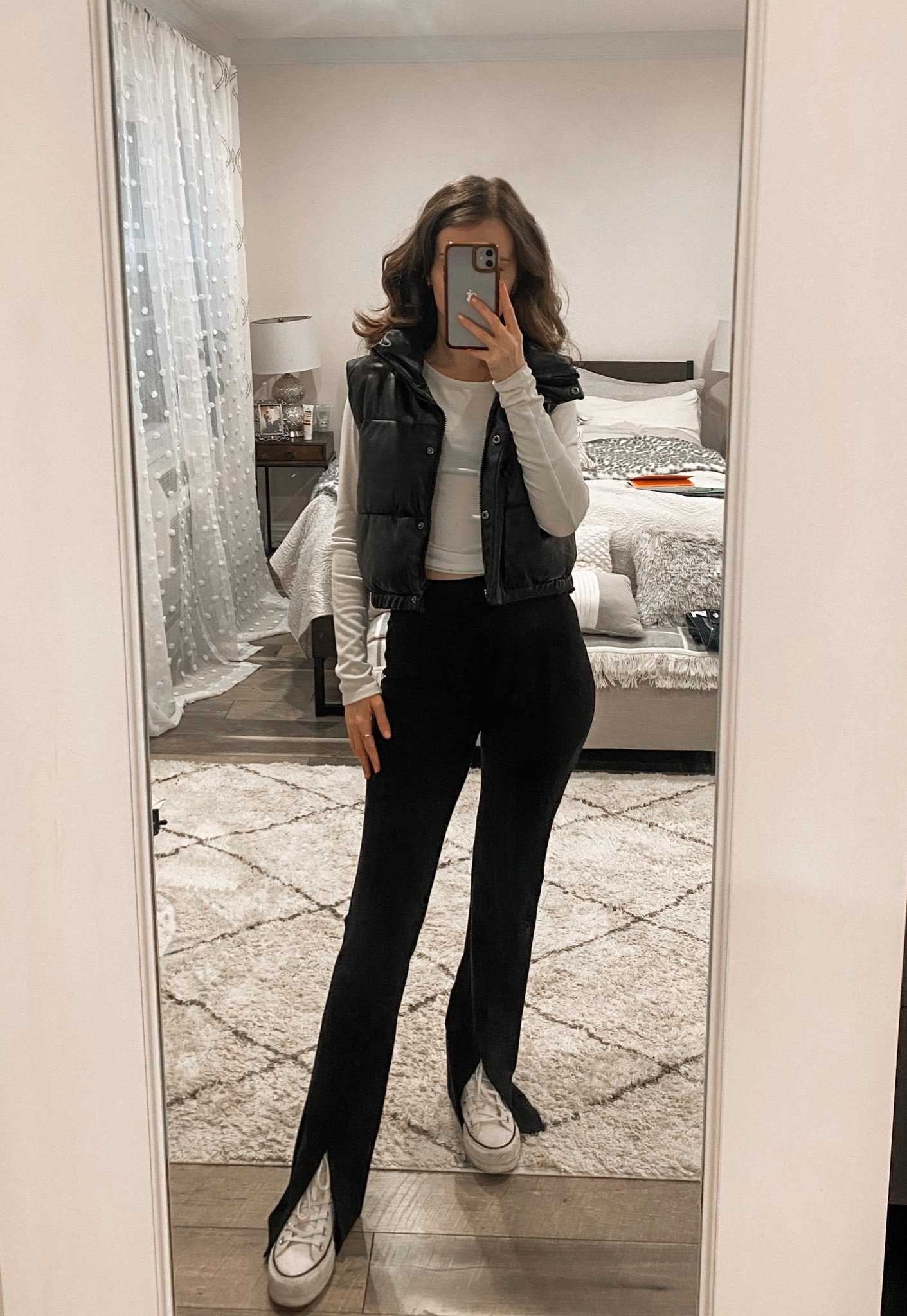 Split hem pants paired with a leather puffer vest, white long sleeve top, and platform converse sneakers makes a cute casual fall outfit. 
.
.
.
.
.
.
#LTKSeasonal #LTKGiftGuide #LTKholiday #LTKxAF #LTKU #LTKcurves #LTKfit #LTKsalealert #LTKshoecrush #LTKstyletip #LTKtravel #LTKunder50 #LTKunder100 #LTKworkwear

Fall outfits | puffer vest outfit | casual outfits | black flare pants | flare leggings | black leggings |  black puffer vest | cropped vest | mini puffer vest | black dress pants | black pants | converse high tops | white sneakers | winter outfit | athleisure | fall outfit inspo | fall outfit ideas | 