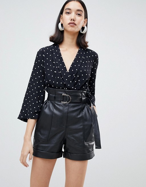 River Island faux leather belted shorts in black | ASOS US