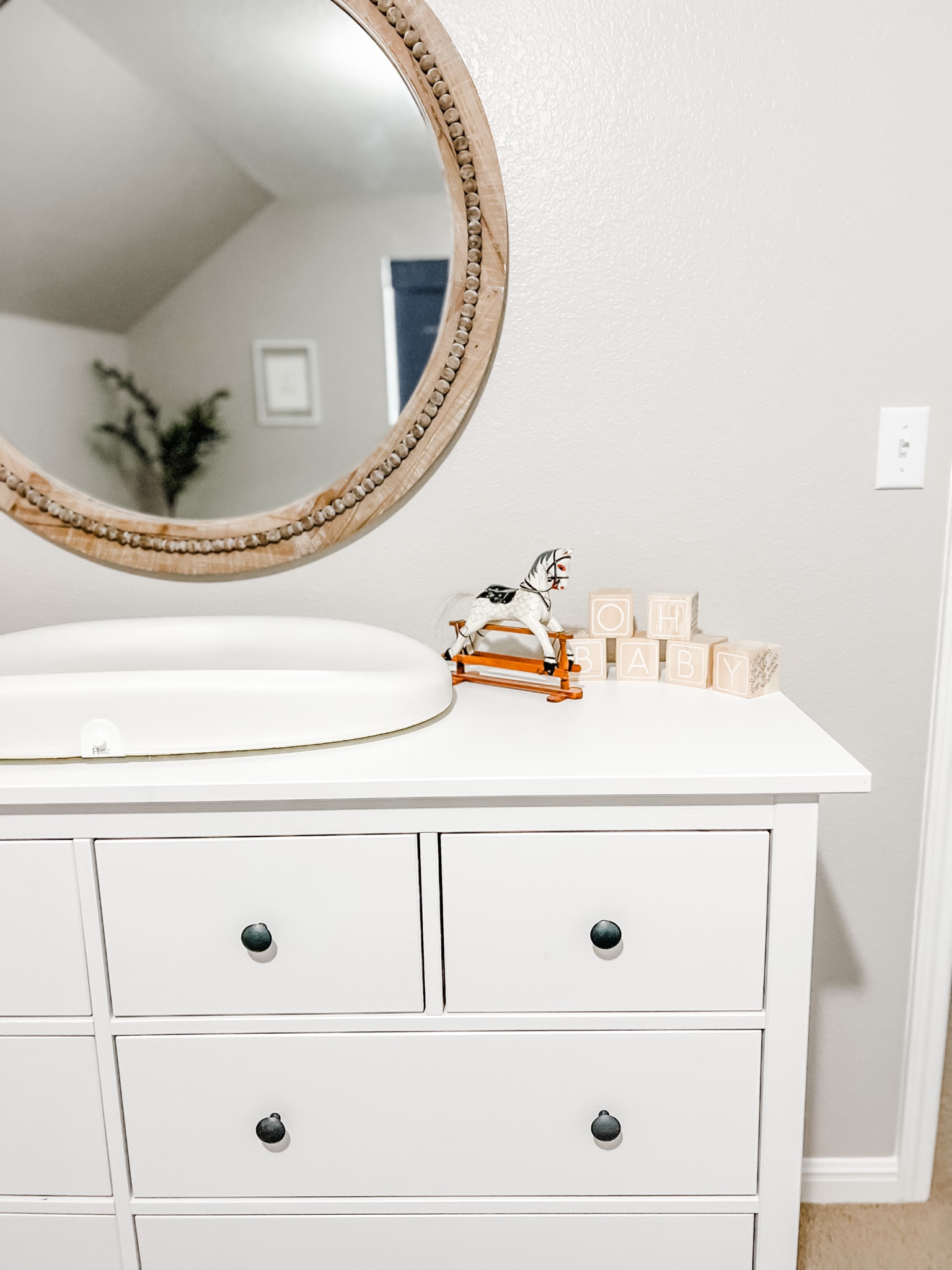 Baby nursery changing table decor. Hatch changing table with scale! Oh Baby blocks, perfect for baby shower guest book — have guests sign their name and write a sweet note on the blocks. Little wooden toy rocking horse. Gorgeous wayfair round wall mirror with beading details. And my favorite faux olive tree (pictured in the corner of the mirror ☺️) 
Baby boy nursery, baby girl nursery, neutral baby room decor. 

#LTKhome #LTKbaby #LTKkids