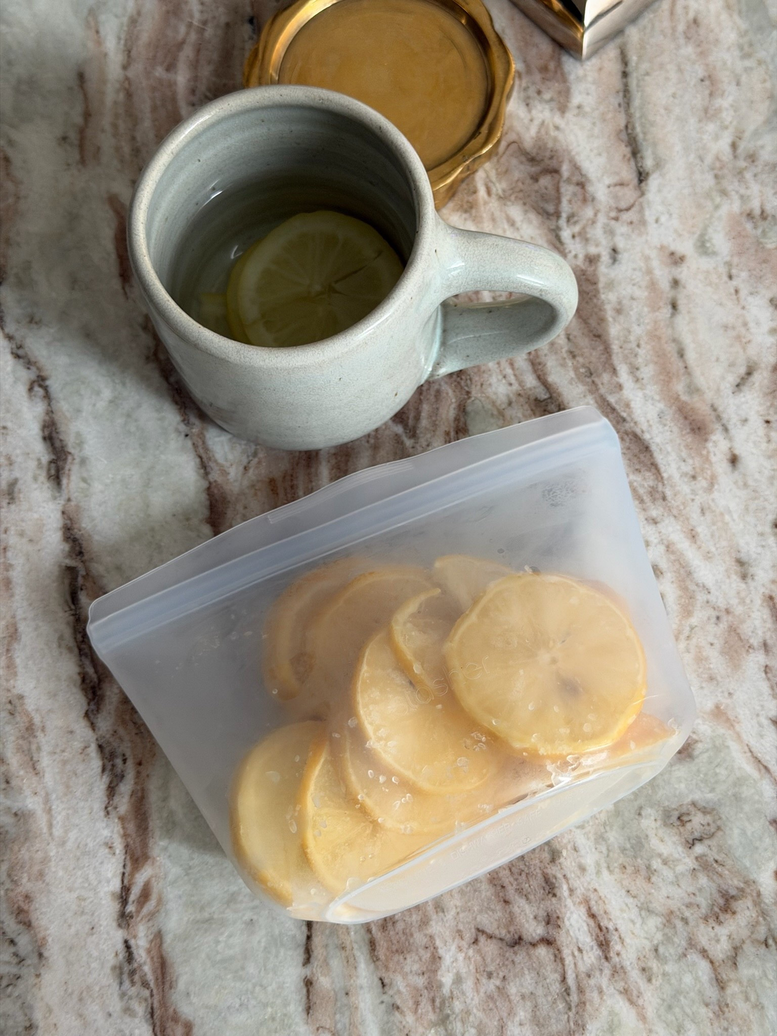 my favorite way to make hot lemon water is to freeze the lemon slices and use them as “ice cubes” 🍋 linking my storage bag and mug!

#LTKHome #LTKfoodie #LTKselfcare