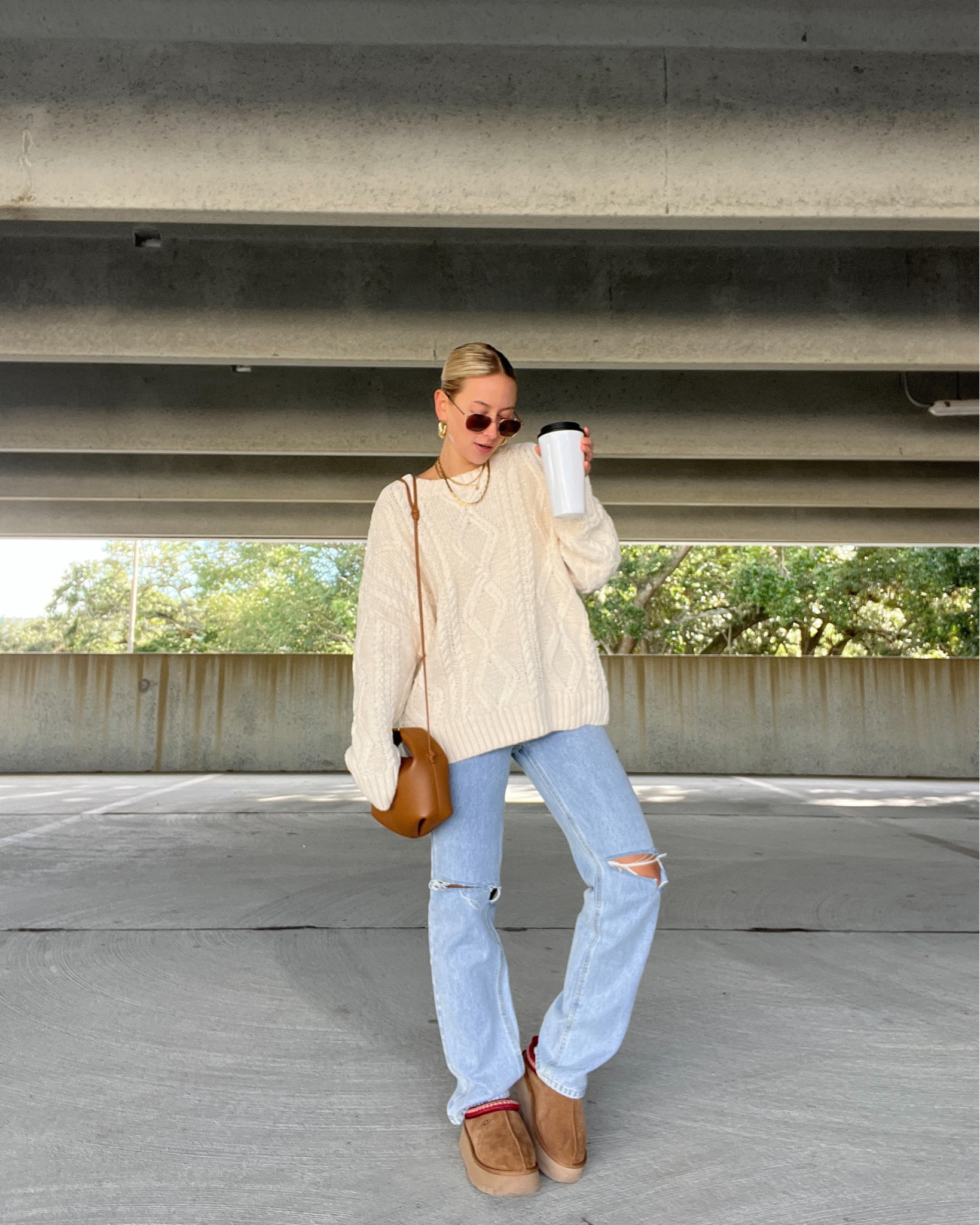 Cable knit sweater, oversized sweater, sweater dress, denim jeans, light wash denim, ugg slippers, ugg tazz, platform Uggs, winter fashion inspo, winter style inspo, winter fashion trends, fall fashion trends, fall style inspo, fall outfit ideas, holiday outfits