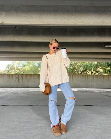Cable knit sweater, oversized sweater, sweater dress, denim jeans, light wash denim, ugg slippers, ugg tazz, platform Uggs, winter fashion inspo, winter style inspo, winter fashion trends, fall fashion trends, fall style inspo, fall outfit ideas, holiday outfits