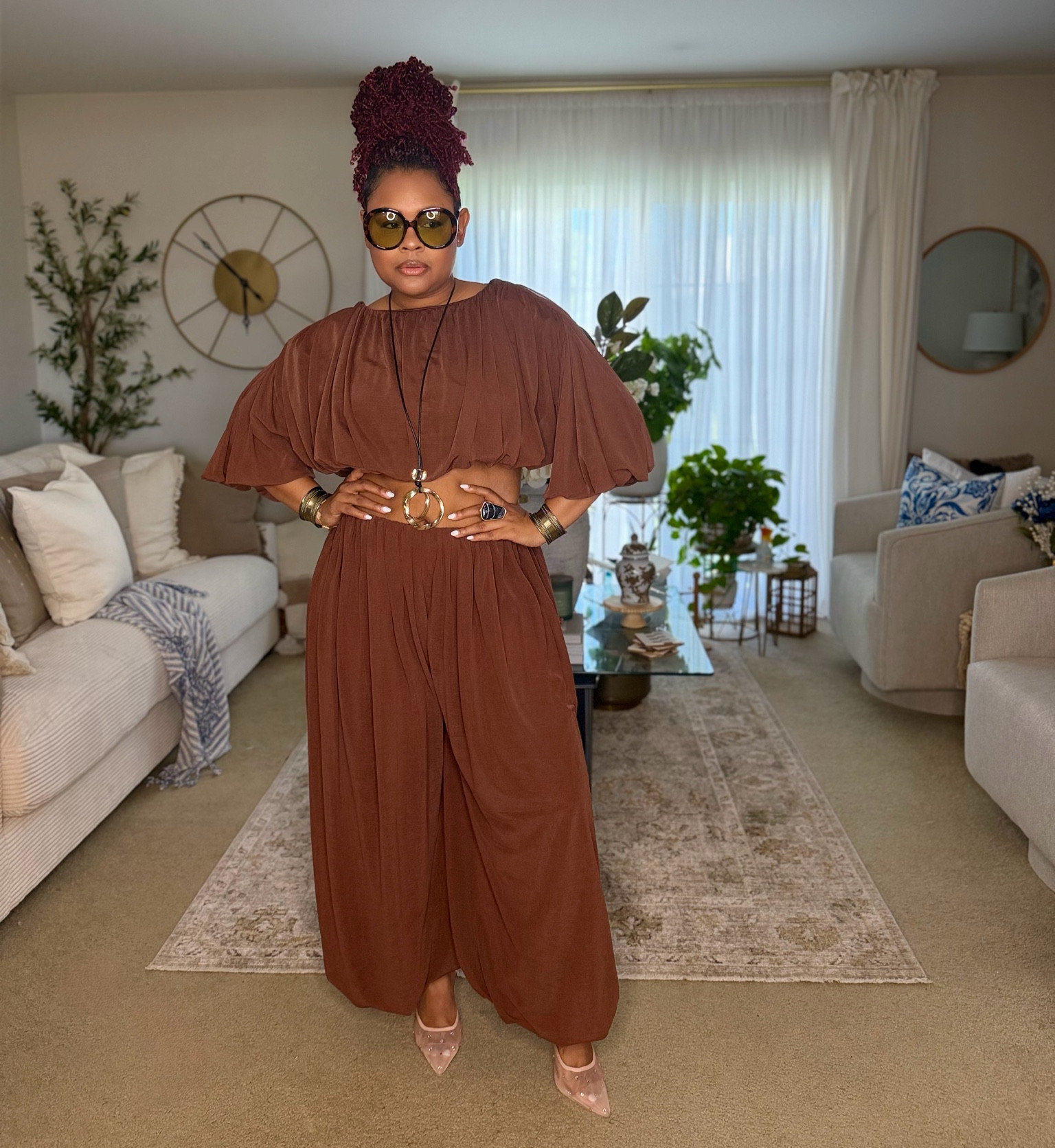 I love pieces that feel effortless but command attention. Draped in rich chocolate tones, oversized accessories, and unapologetic confidence this look is proof that style is more than clothing, it’s presence. 
