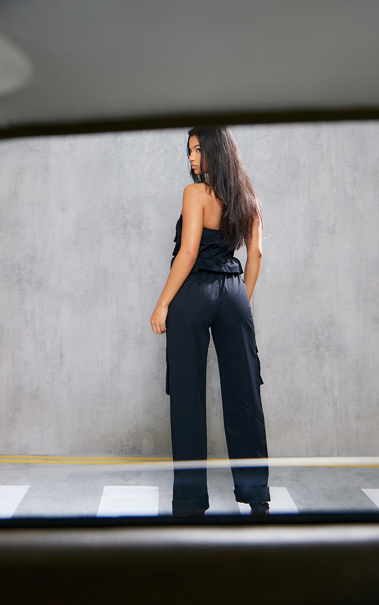 Black Cargo Bandeau Pocket Detail Frill Waist Jumpsuit | PrettyLittleThing US