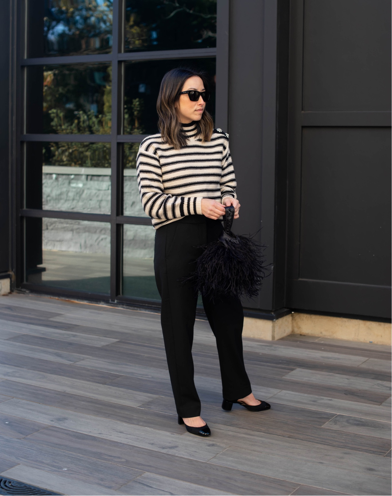 Leaning on @jcrew for all my holiday needs. Love this festive sweater and fun bag for holiday parties. #ad #injcrew