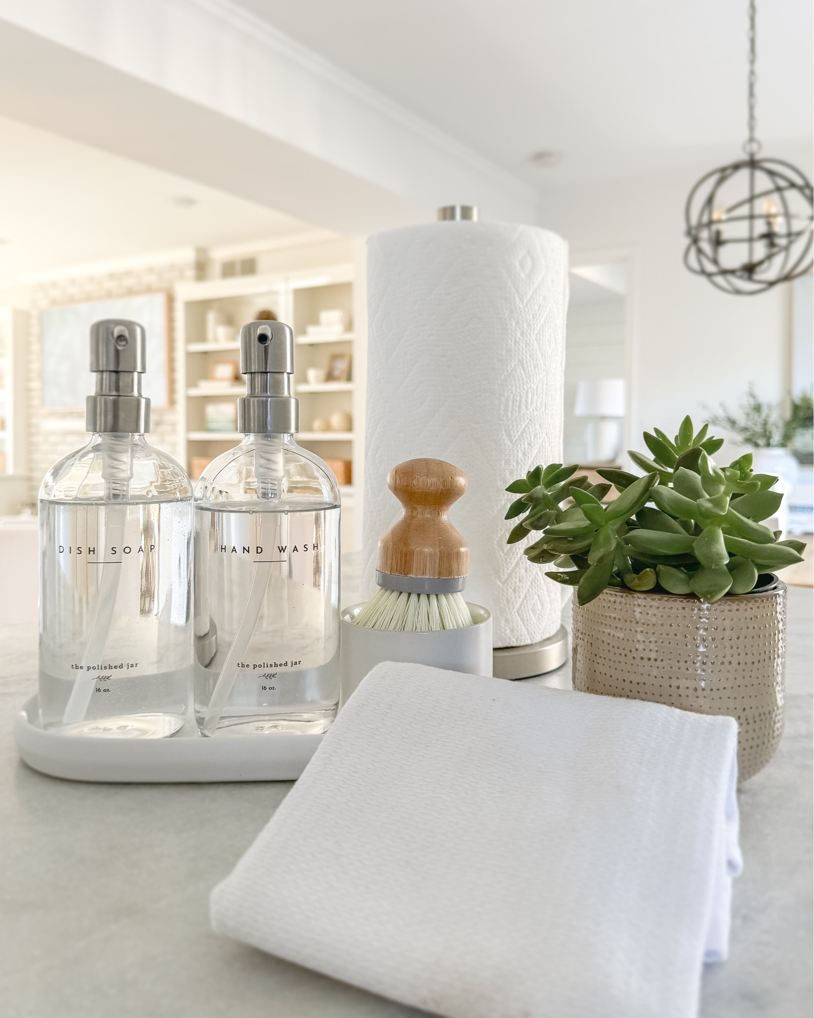 Simple and beautiful kitchen counters.
.
Soap dispenser. Dish brush. Paper towel holder. Dish rags.

#LTKfindsunder50 #LTKfamily #LTKhome