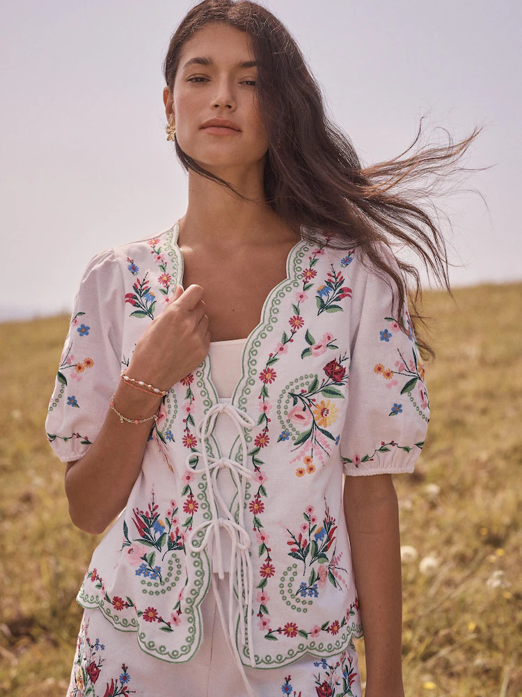 Love & Roses x RHS Ivory Embroidered Floral Tie Front Short Sleeve Scallop Blouse | Next US