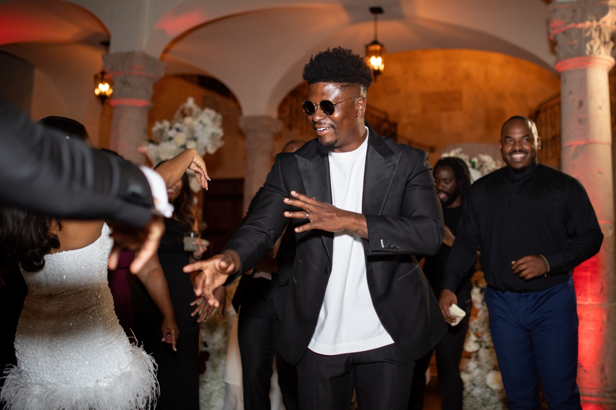 Black blazer with white tee and black sunglasses