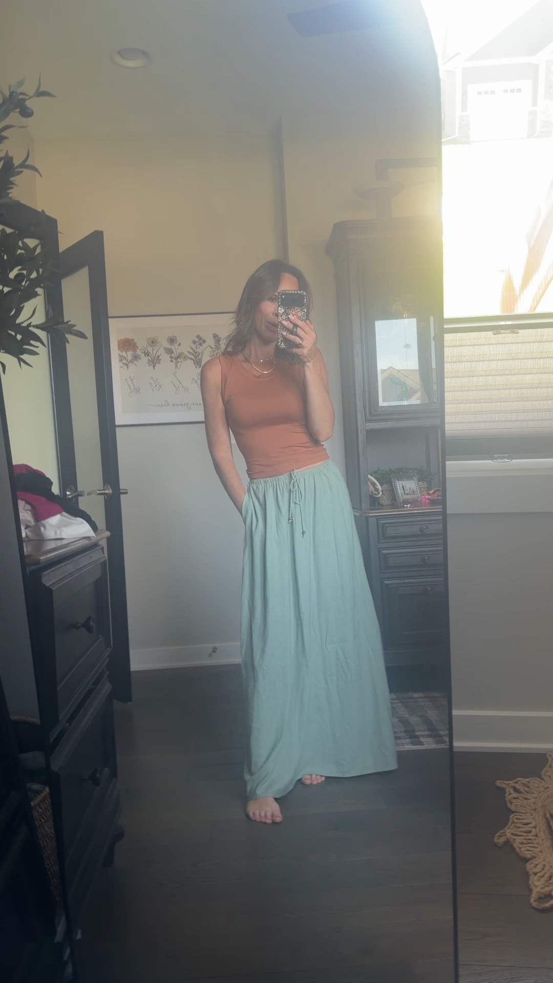 OMG, this is the last day that these tanks are on sale, and I love them! The neck line is so pretty and flattering and the cut is great. They are not too long, they are the perfect stretch, with a super soft fabric. If between sizes, size up. But, for five dollars, I would grab a bunch of colors. This skirt is sold out in this color, but I also have the white ivory color, which is beautiful as well!

#LTKOver40 #LTKSeasonal #LTKootd