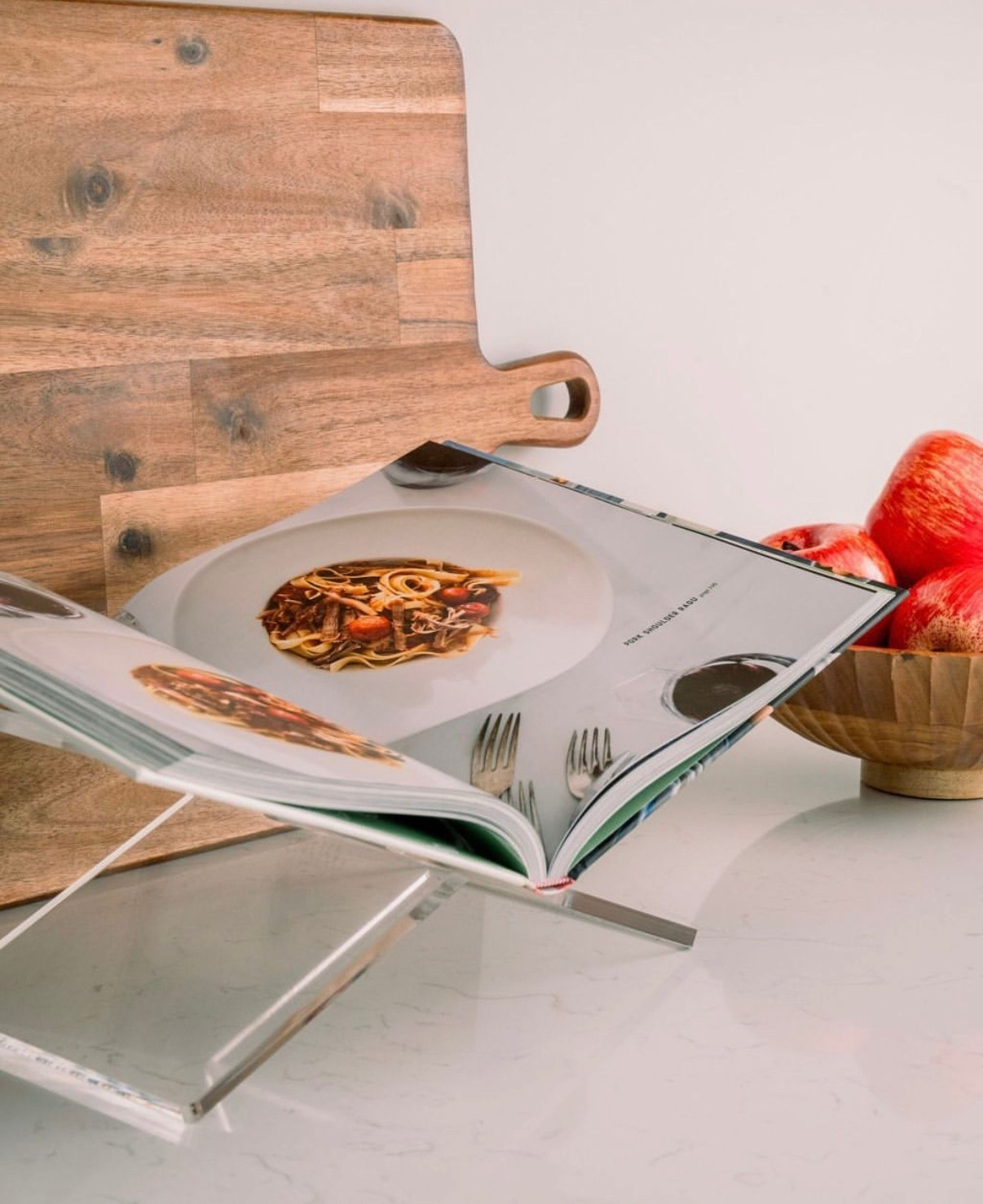 Nothing like a good cookbook moment 🤍 I’ve been loving this acrylic cookbook stand — it keeps my pages open and mess-free while I cook. Paired with a pretty wooden cutting board + fresh fruit for a cozy counter setup 🍎🍴

#LTKStyleTip #LTKSeasonal #LTKHome