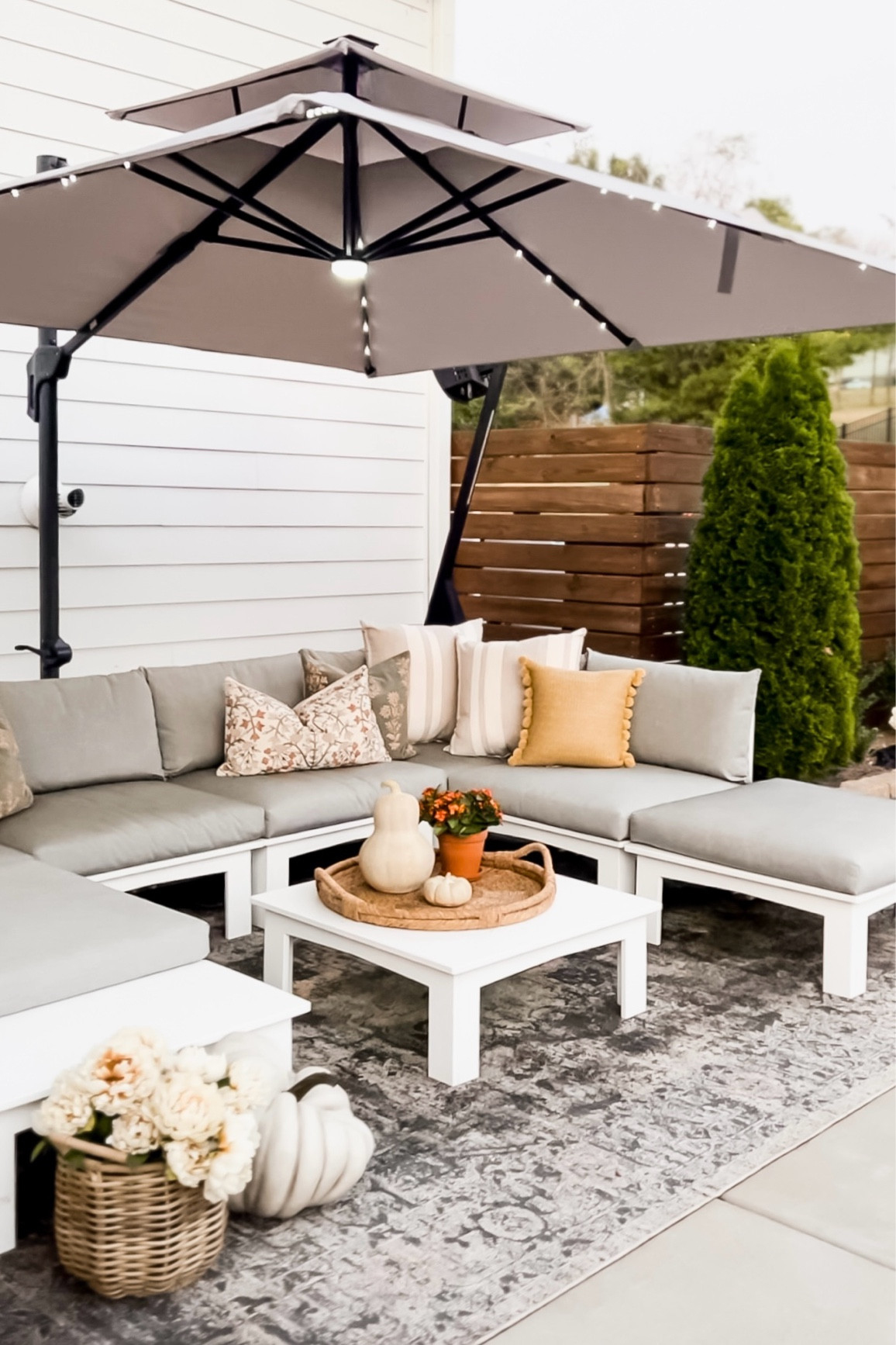 Here’s our back patio ready for fall! It still gets so hot out here in the sun so we added this cantilever umbrella that actually includes the base and is affordable! It also has solar lights which is awesome! It comes in a lot of colors and we have the fog gray. I’m also linking my pillows, pumpkins and rug here! 

#LTKHome #LTKStyleTip #LTKVideo