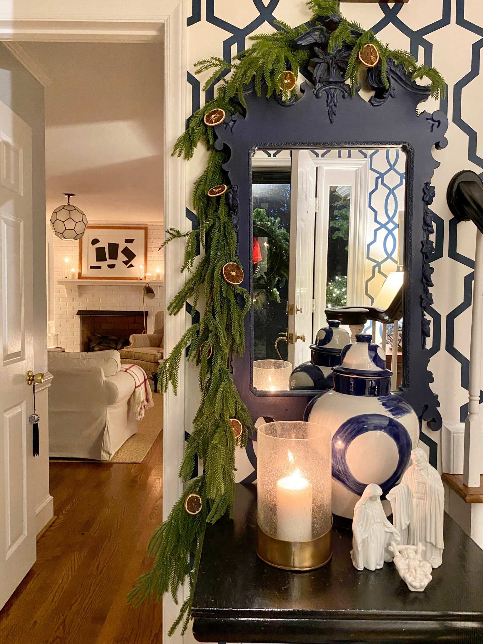 Christmas entryway decorations, faux garland, orange slices, navy, blue and white trellis wallpaper

#LTKHoliday #LTKSeasonal #LTKHome