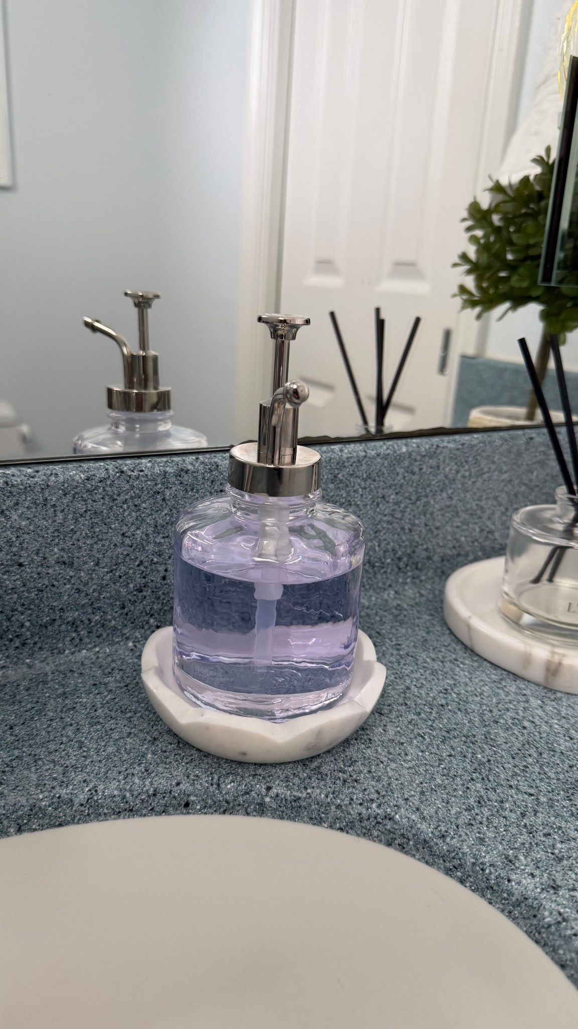 Upgraded my soap dispenser in my powder room. I decided I wanted a classic clear glass pump. This is perfect and affordable too! 

#LTKHome