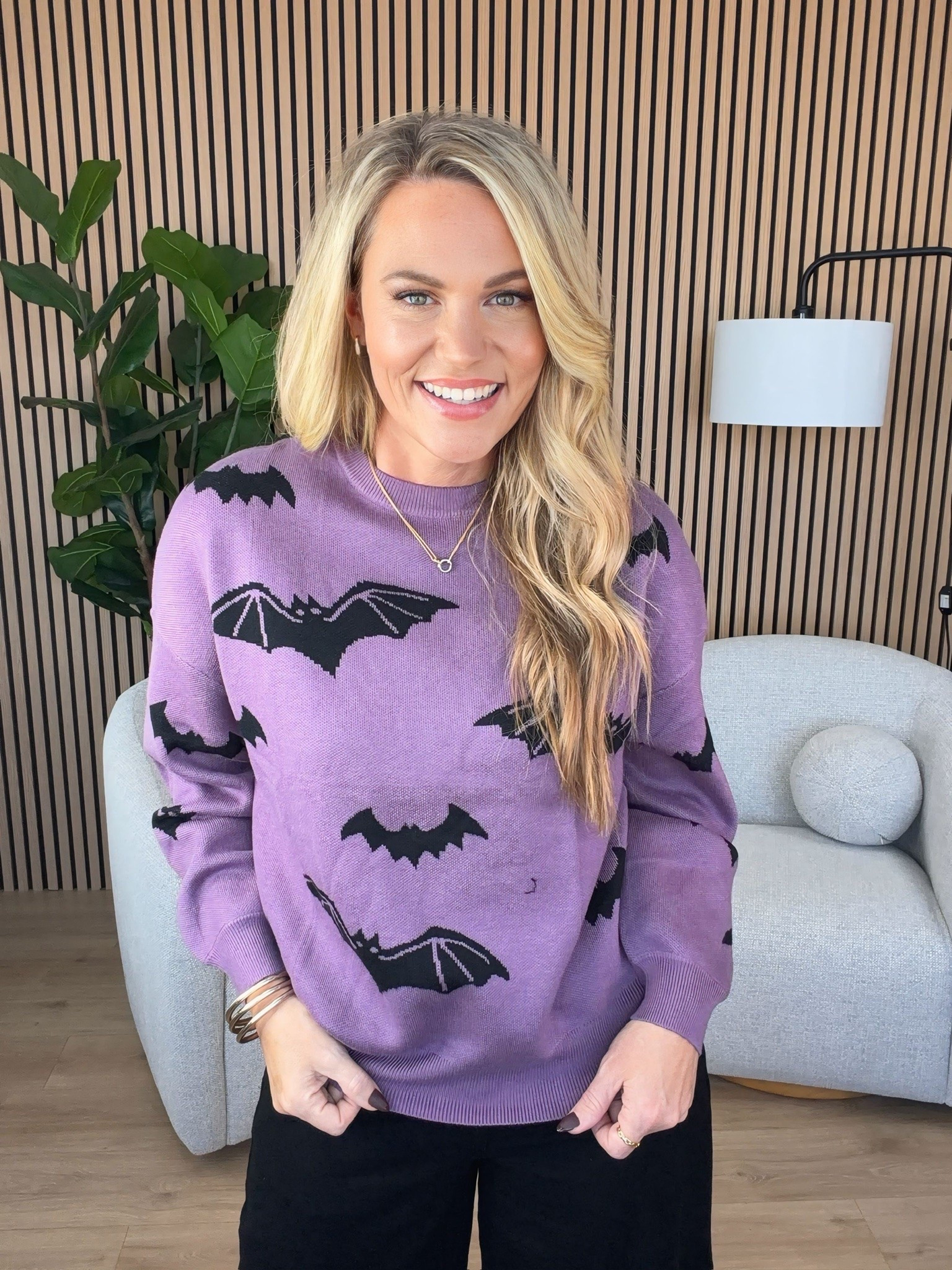 Proof that Halloween can still look like me. I kept the rest of the outfit simple with black pants and heels, then let the purple bat sweater be the fun part without turning the whole look into a costume.

Sizing:
Sweater: Standard
Pants: Size 2
Heels: Size 7.5, true to size

halloween sweater, purple sweater, bat sweater, black pants outfit, halloween outfit ideas, fall fashion, festive sweater, classic halloween style, women’s seasonal fashion, AudrieDollins